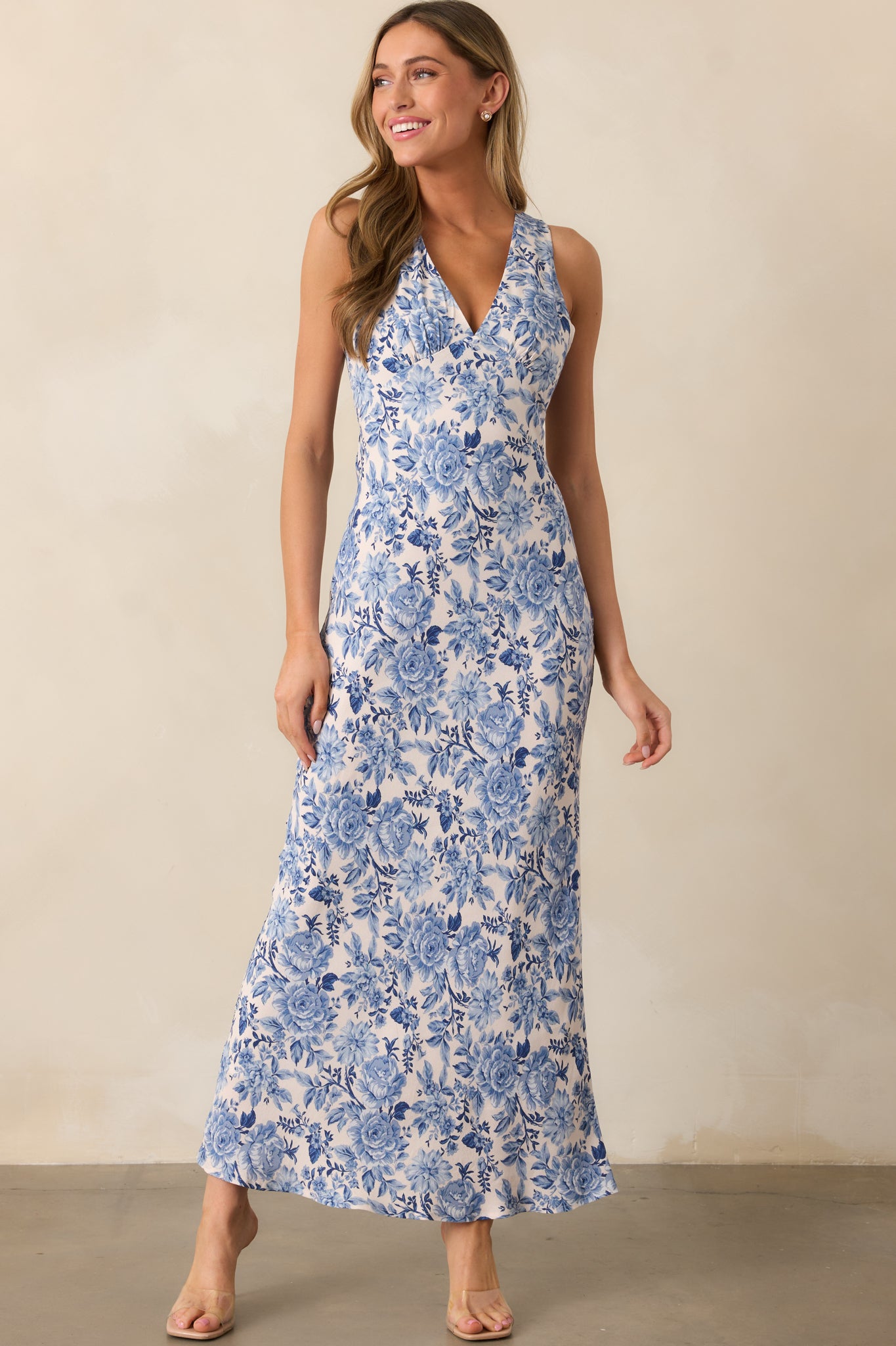 The fitted bodice hugs the figure, while the maxi-length skirt drapes beautifully for an effortless look.