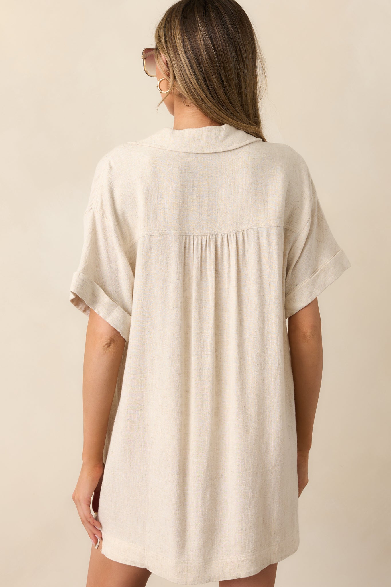 The relaxed fit of this dress drapes effortlessly, complementing the clean and simple back design.