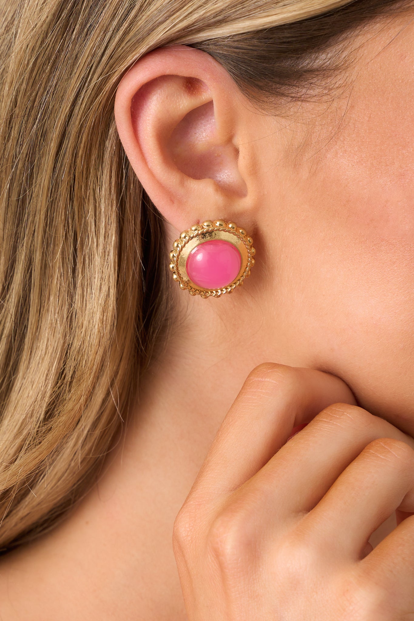  detailed view of the pink and gold earrings, highlighting the large pink center, gold border, and the intricate gold beaded detailing for a sophisticated touch.