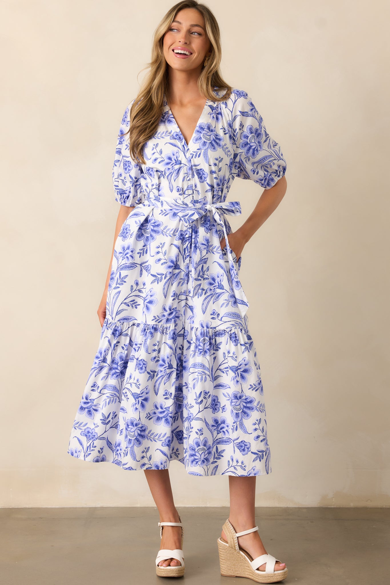 The dress’s floral print and self-tie waistband create a flattering shape, while the button front adds a classic touch.