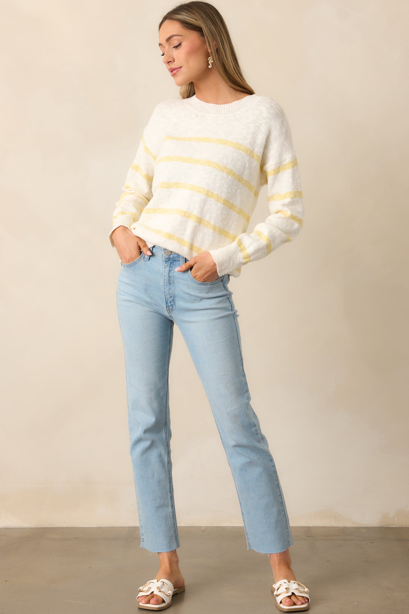  Ivory sweater with a lightweight design and yellow stripe detailing, perfect for a casual yet polished look.