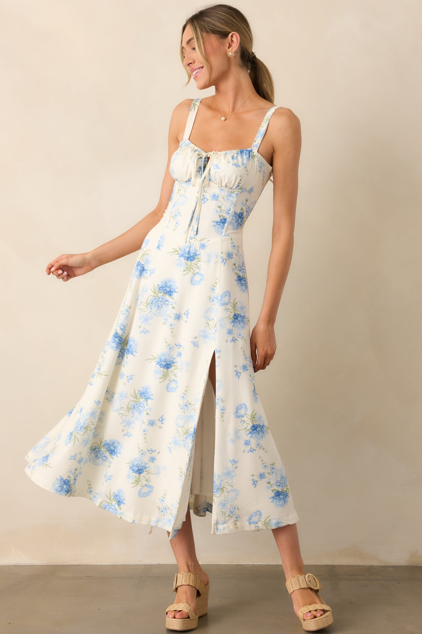 A flowy floral dress with a self-tie corset back and a discrete side zipper for a seamless fit.