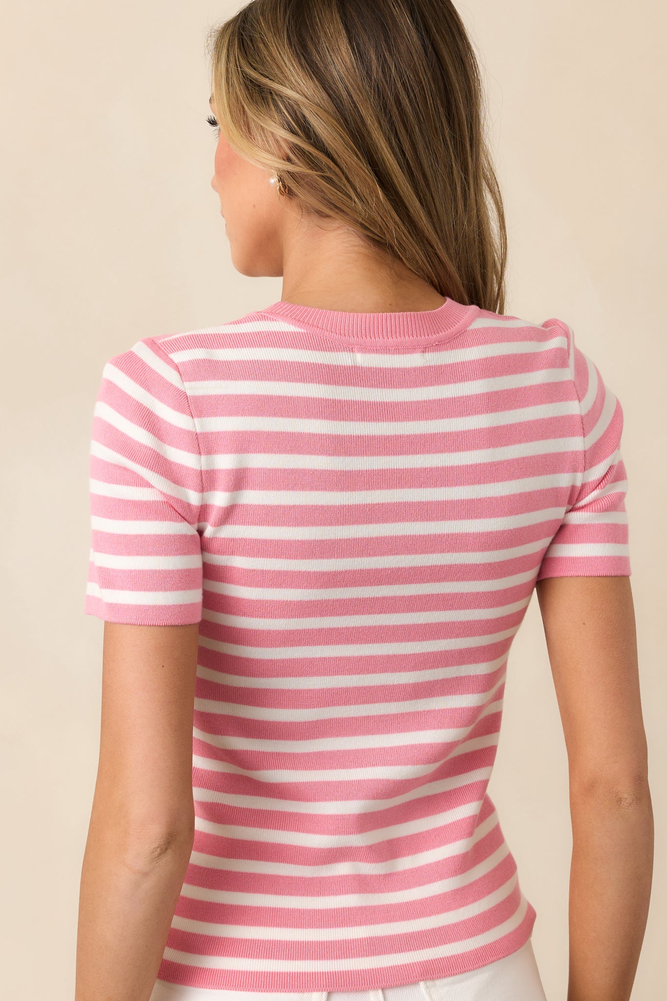 The back of this pink top continues the stripe design seamlessly, keeping the look cohesive and stylish.