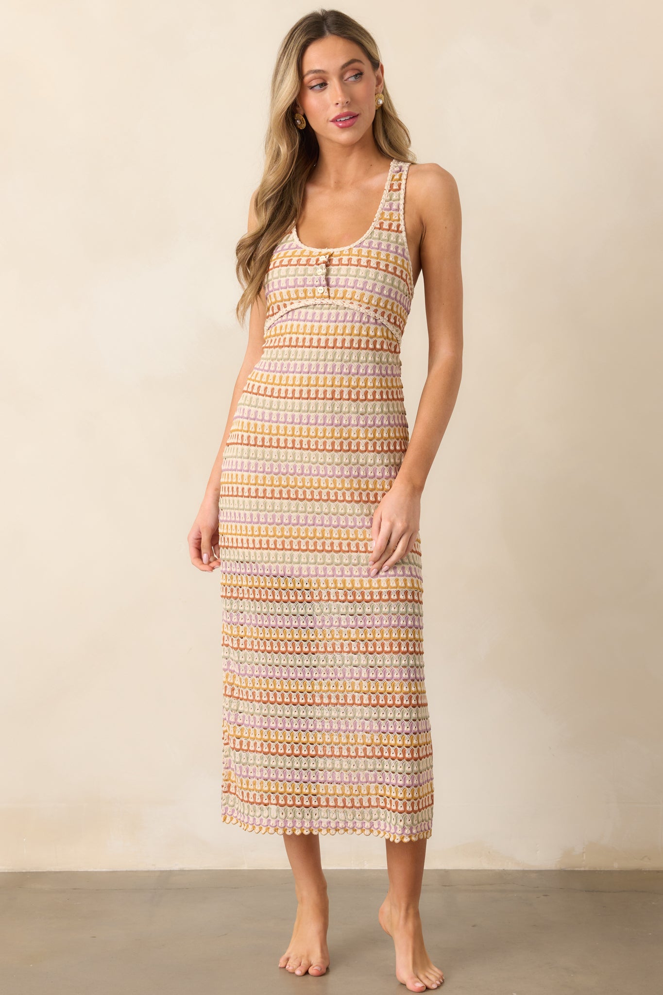  This natural multi dress combines a scoop neckline, crochet details, and a mini skirt underlay for a chic, summery look.