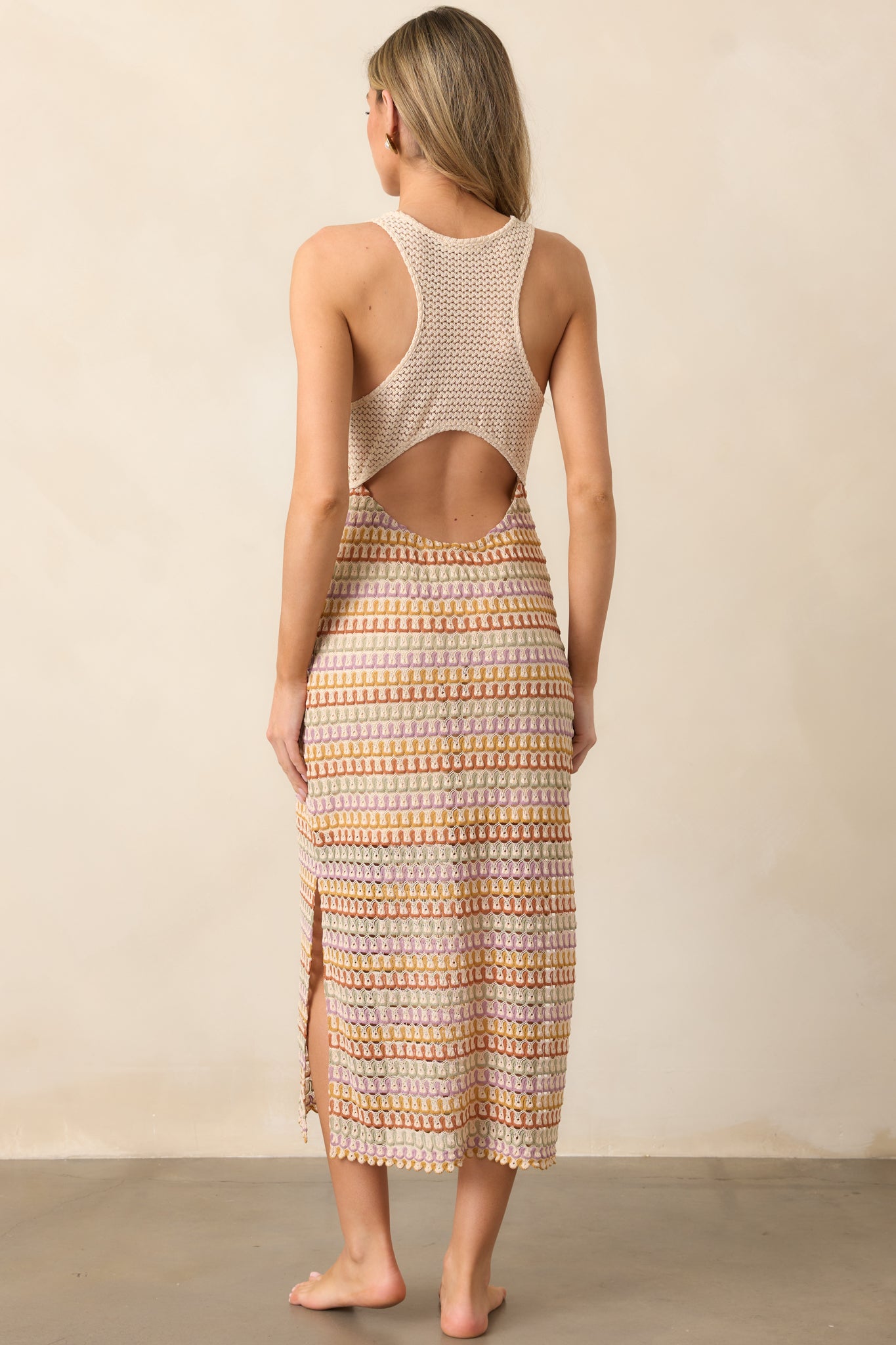 The crochet racerback design of the natural multi dress adds a unique, stylish touch, creating an elegant back view.