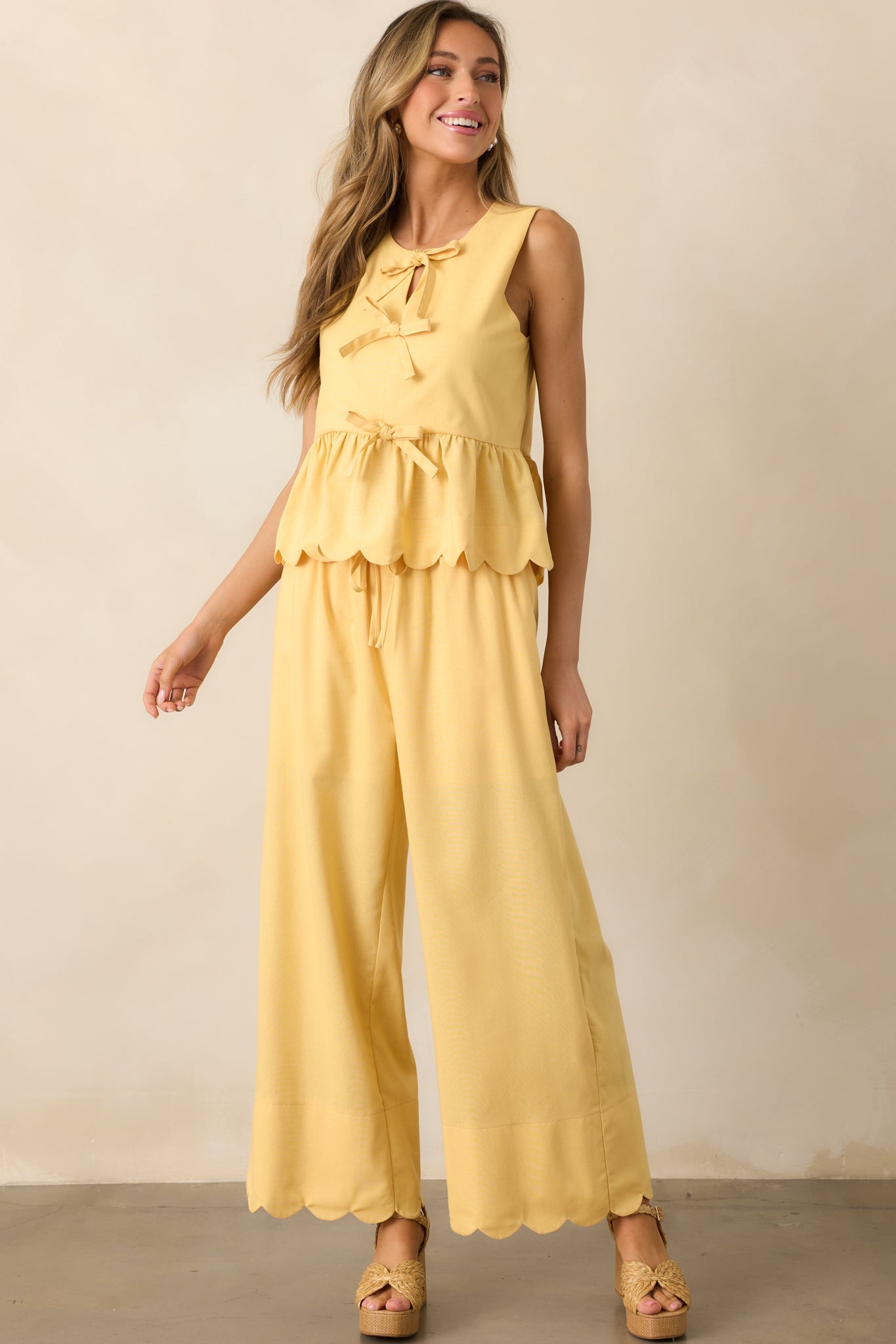 Bright yellow pants with a high waist and wide-leg design, creating a flowy and effortless look.