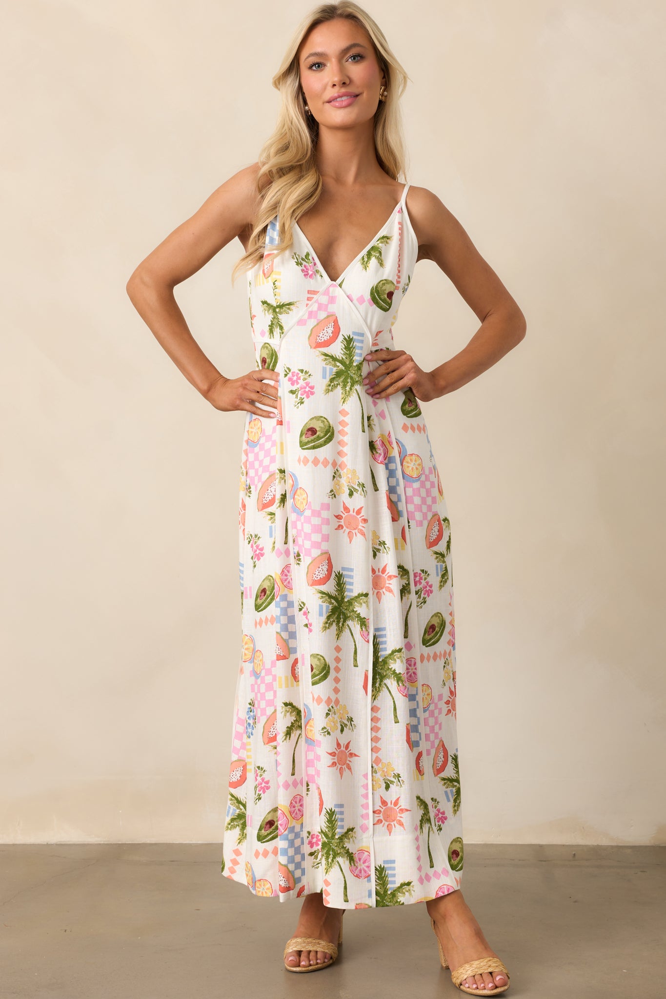 Ivory dress with a vibrant multicolor tropical print and a flattering V-neck neckline for a breezy, stylish look.