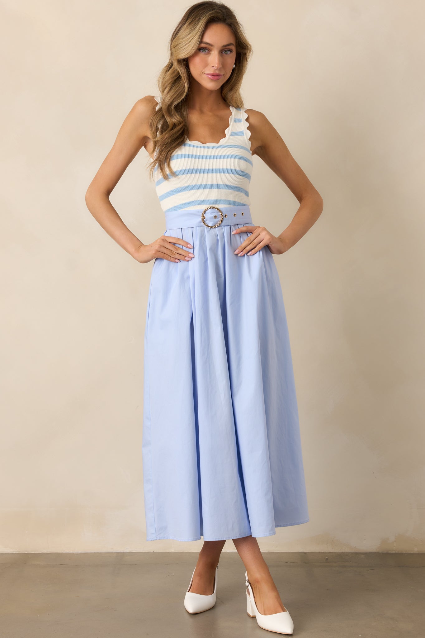 Classic blue midi dress with a fitted top and relaxed skirt, designed for comfort and style.