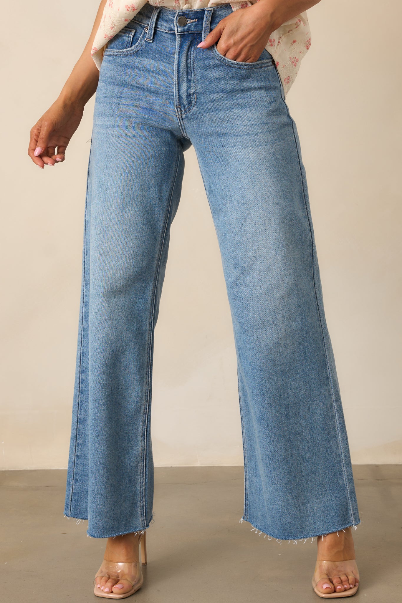 A closer view of the jeans' high-waisted design and wide straight-leg fit, highlighting the structured yet comfortable style.