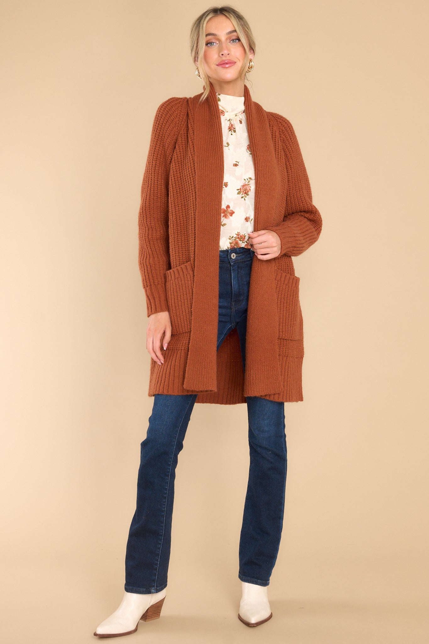 Full body view of  this cardigan that features a folded neckline that extends down the front and a knit texture throughout.