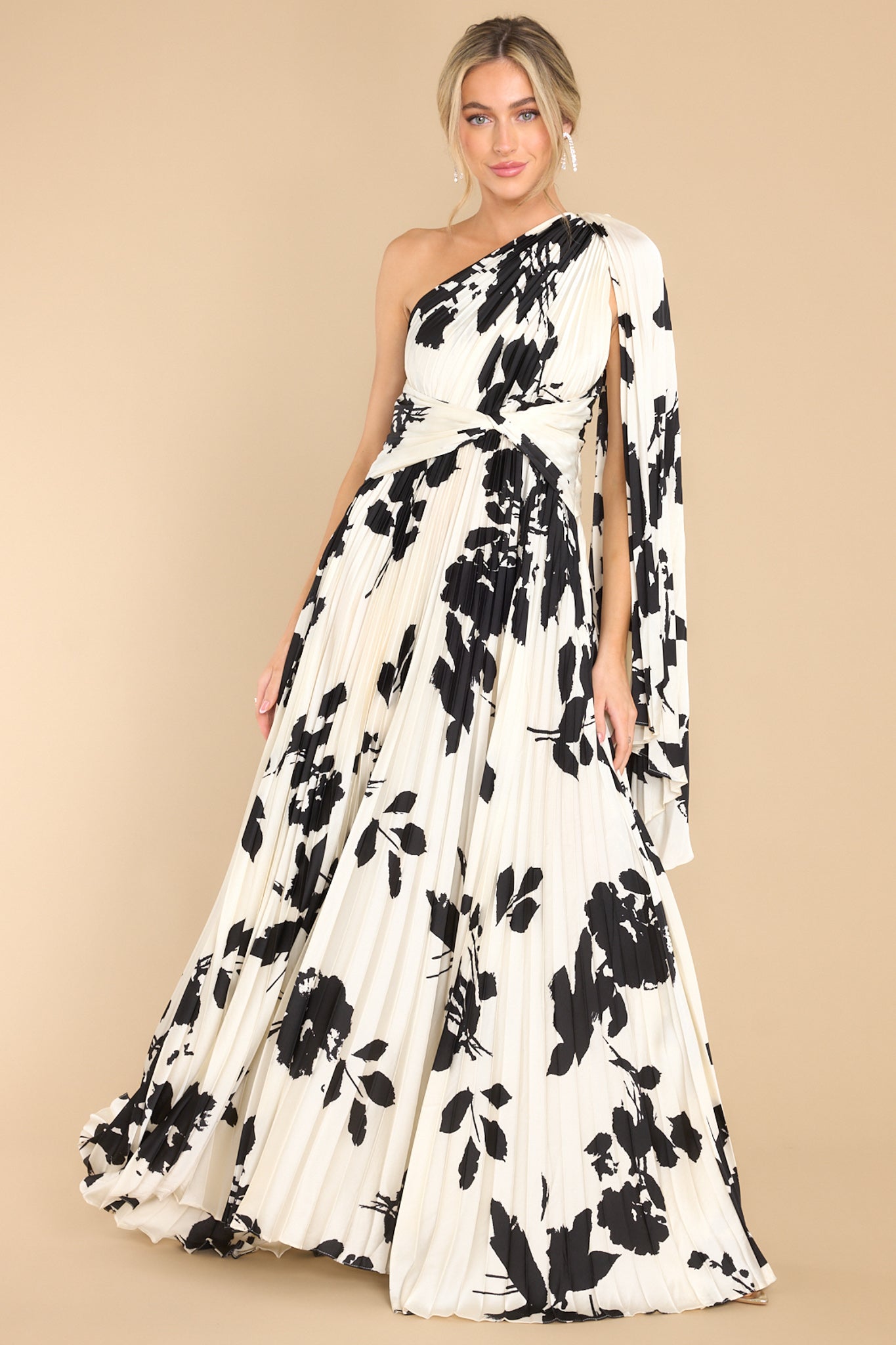 Full body view of this ivory dress that features black floral.