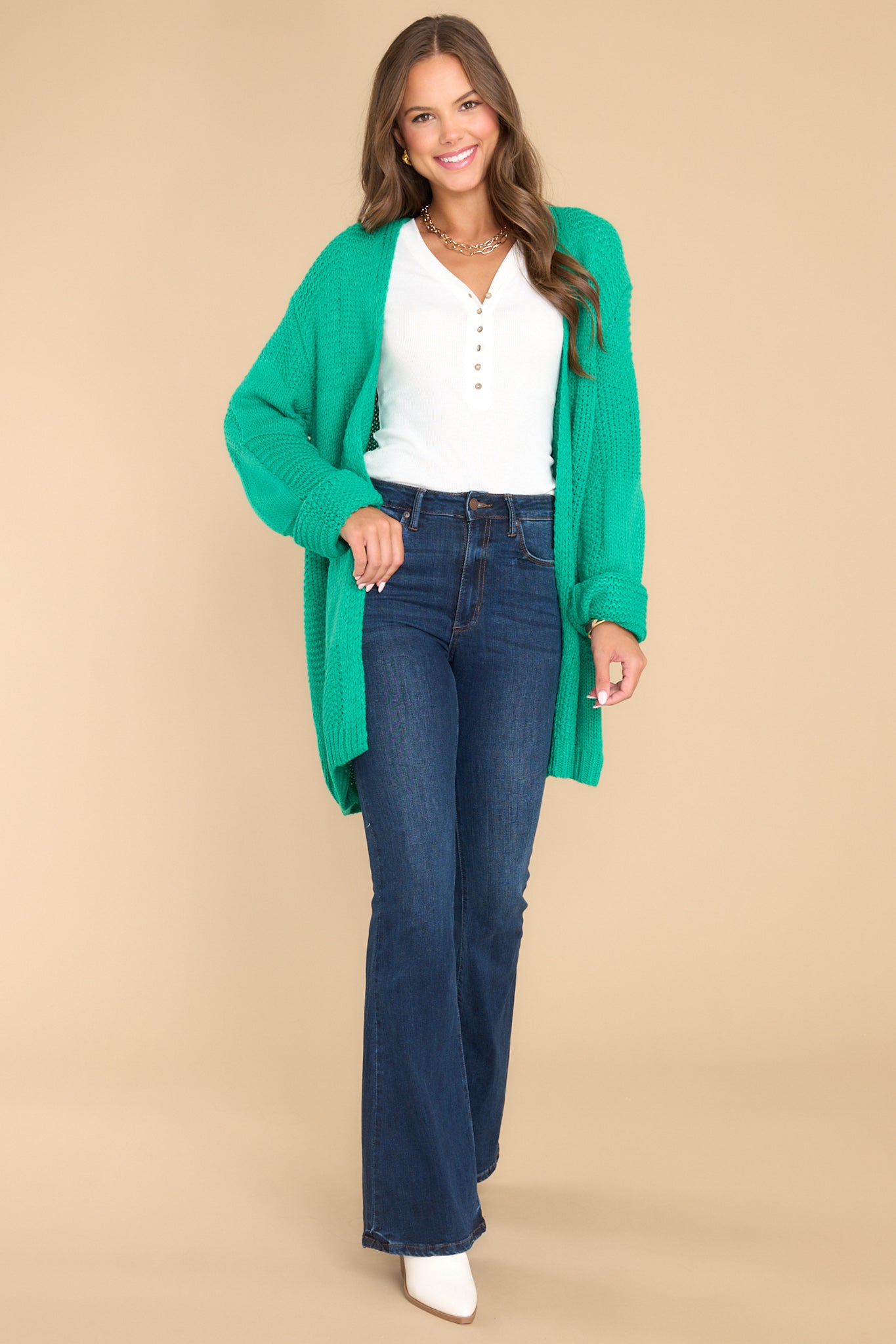 Full body view of this cardigan that features a chunky square knit design with long sleeves and ribbed cuffs.