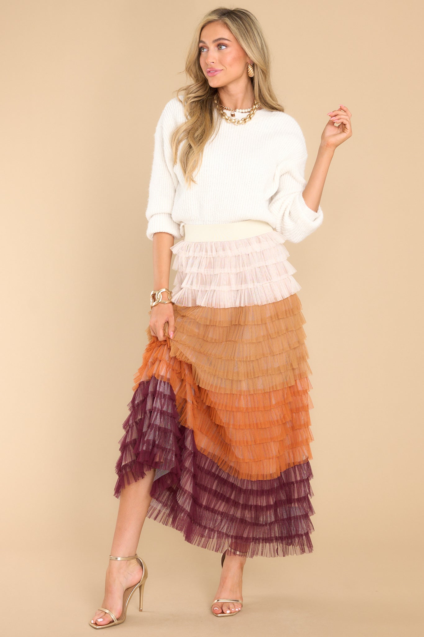 Full body view of this skirt that features a ruffle tulle detailing throughout.