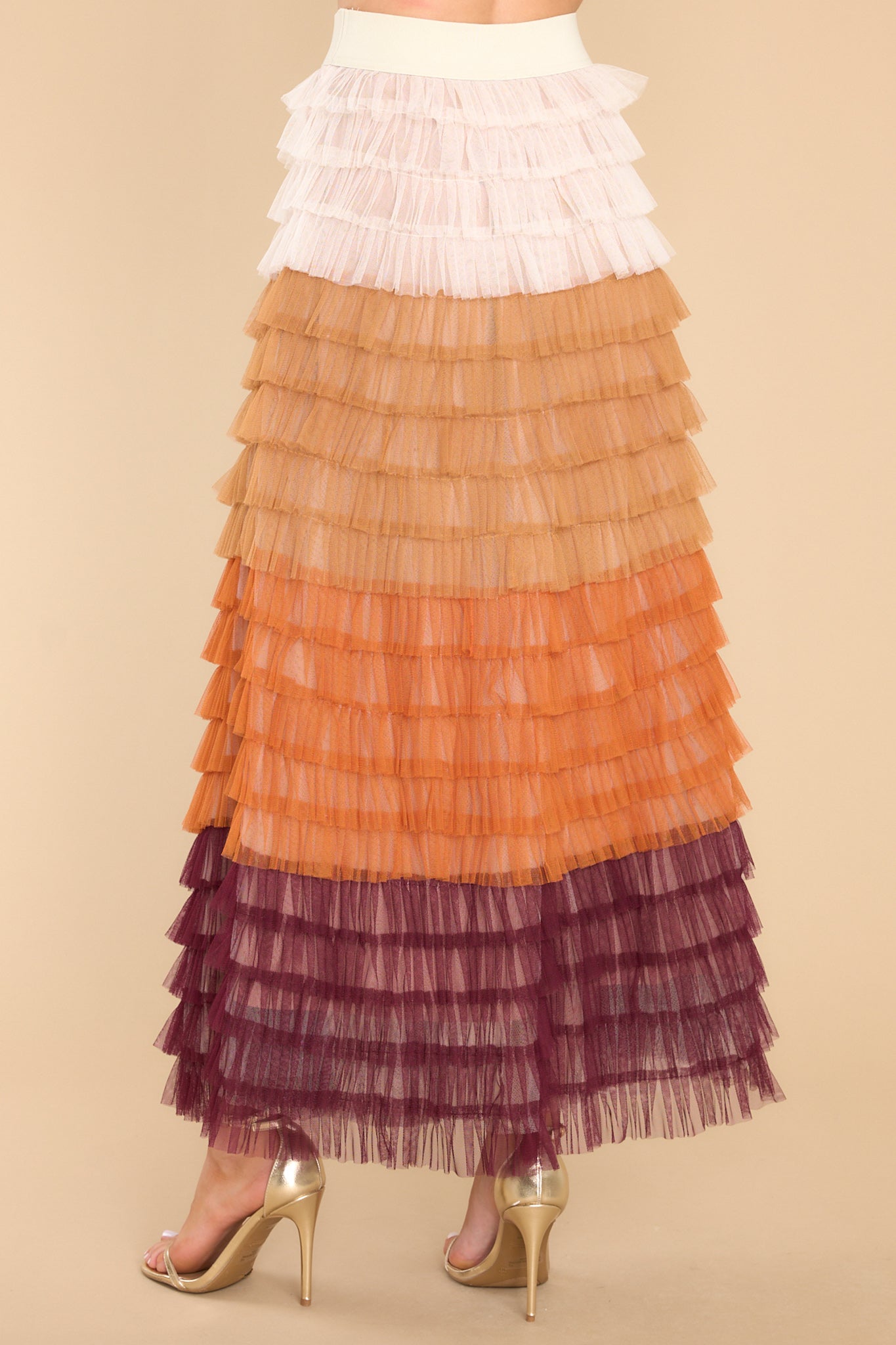 Back view of this skirt that features a high waist design, an elastic waistband and ruffle tulle detailing throughout.