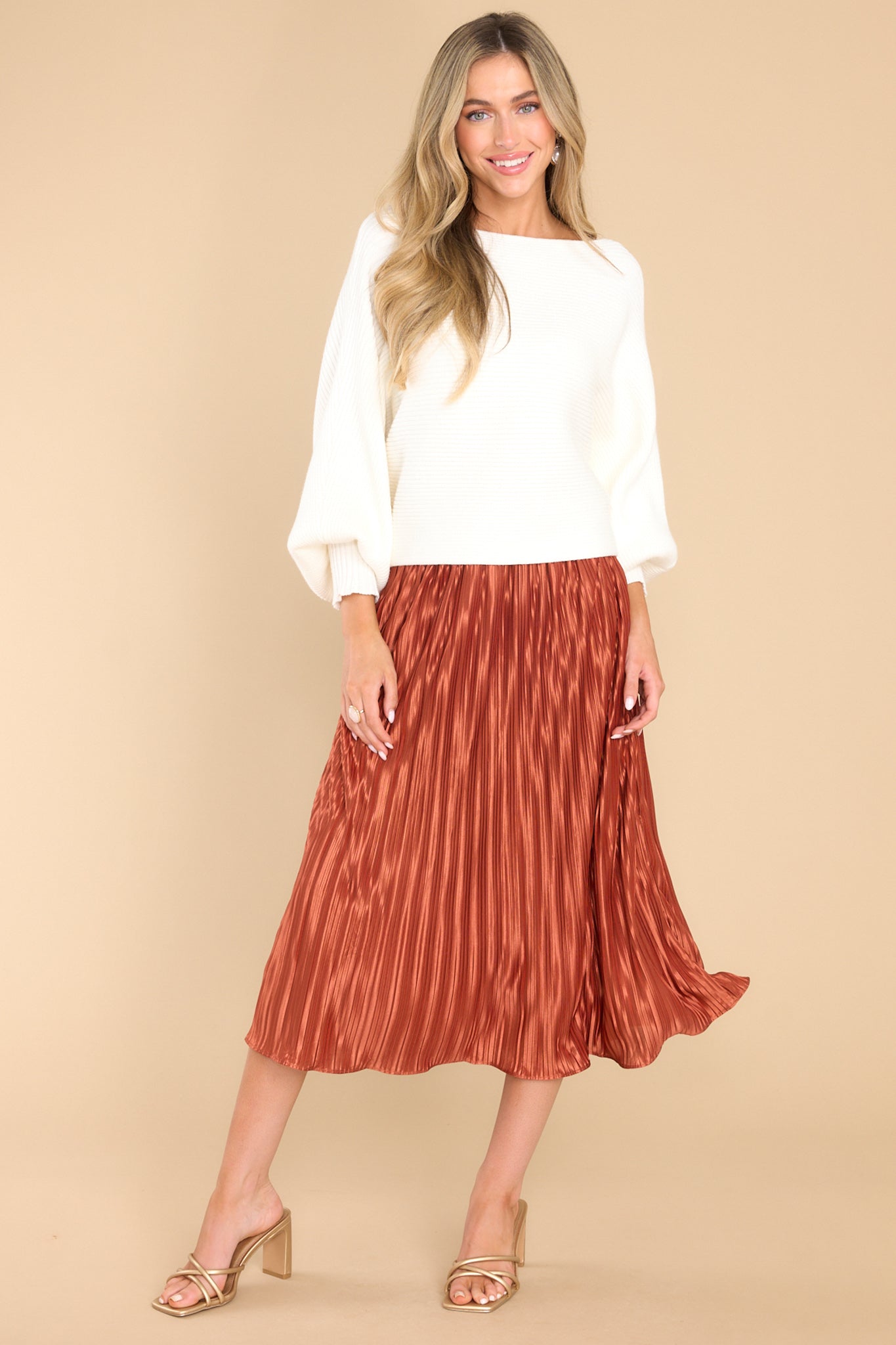 Full body view of this skirt that features an elastic waistband and a pleated design.