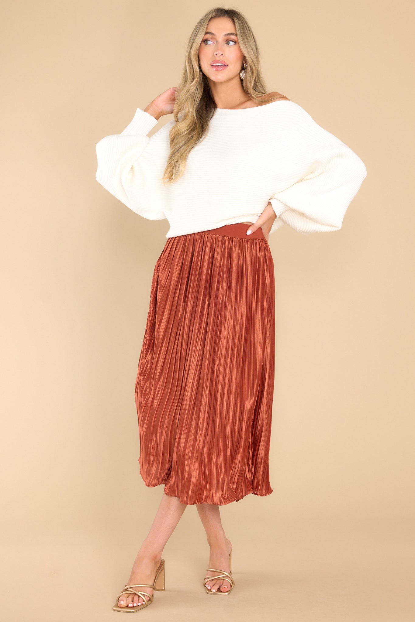 Full body view of this skirt that features a pleated design.