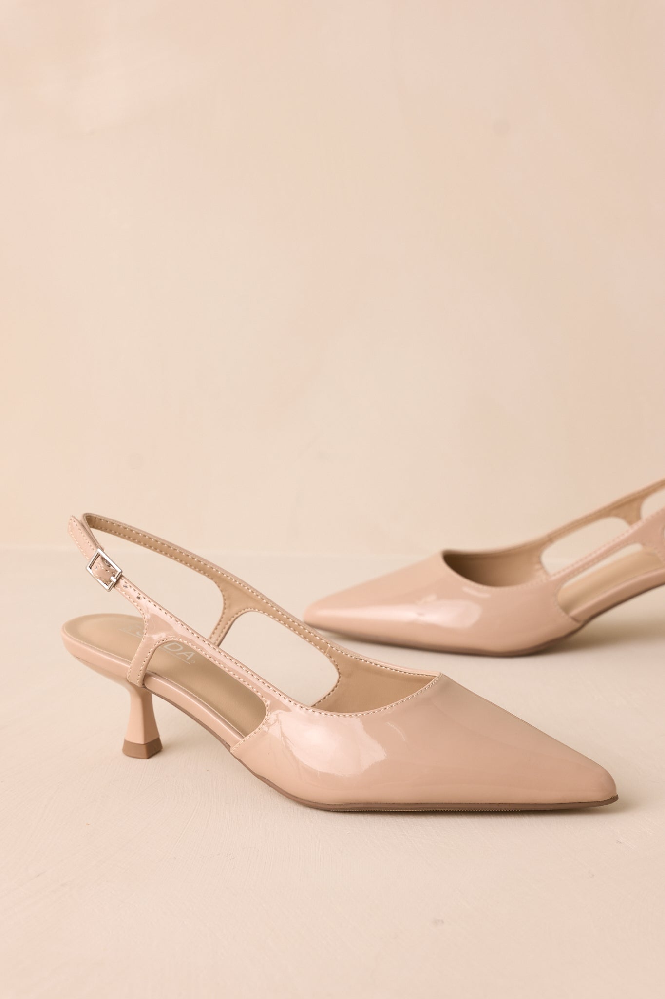 Fiercely Stunned Nude Patent Kitten Heels