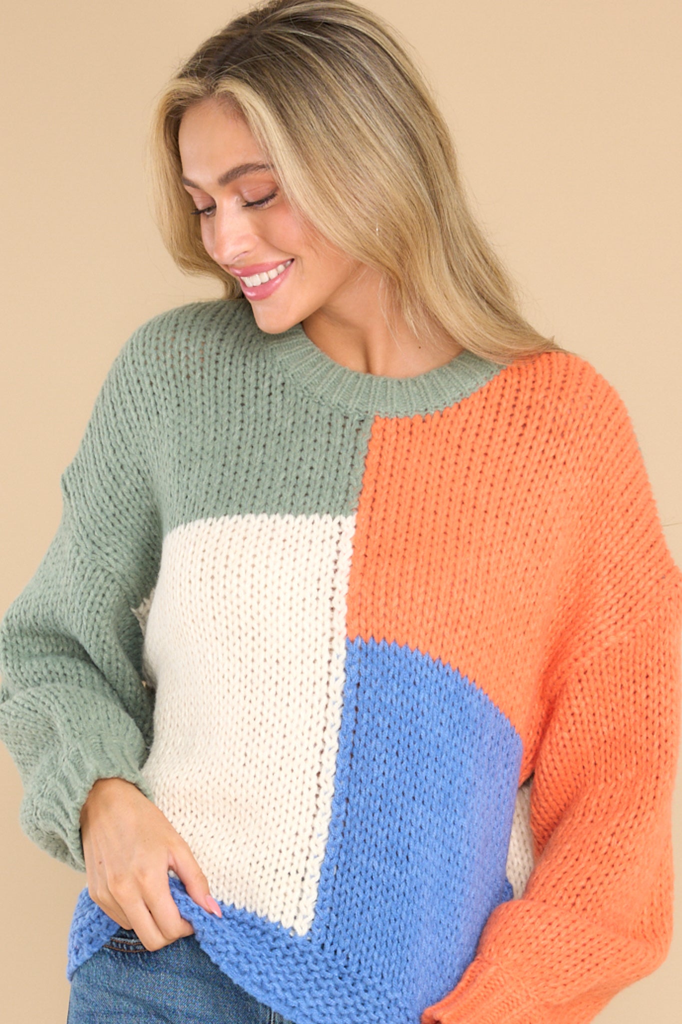 Front view of  this sweater that features a round neckline.