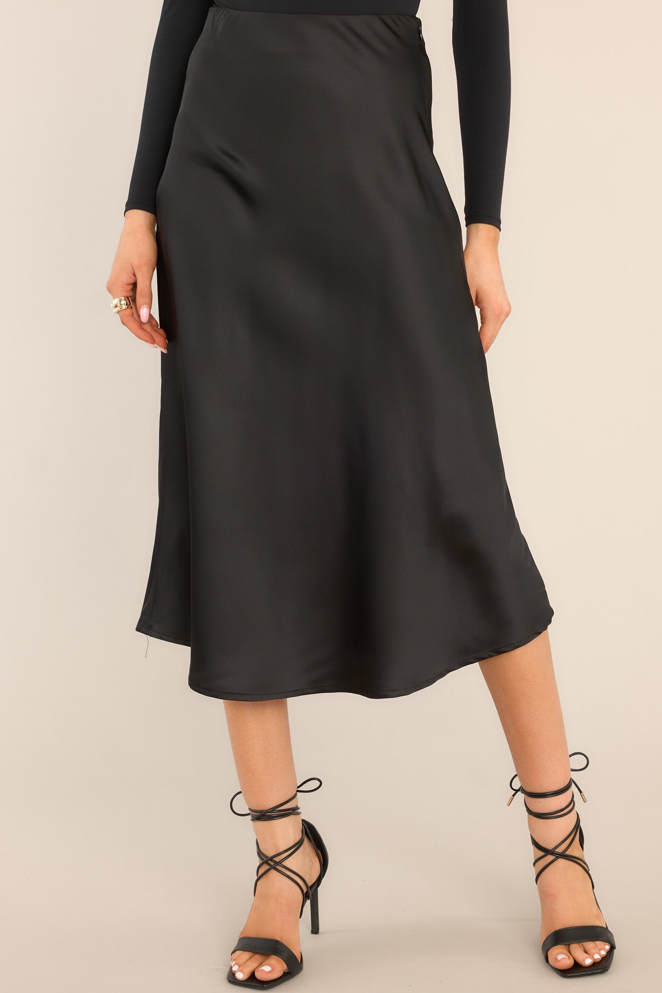 Front view of this skirt that features an elastic waistband, a side zipper closure, and a long flowy skirt.