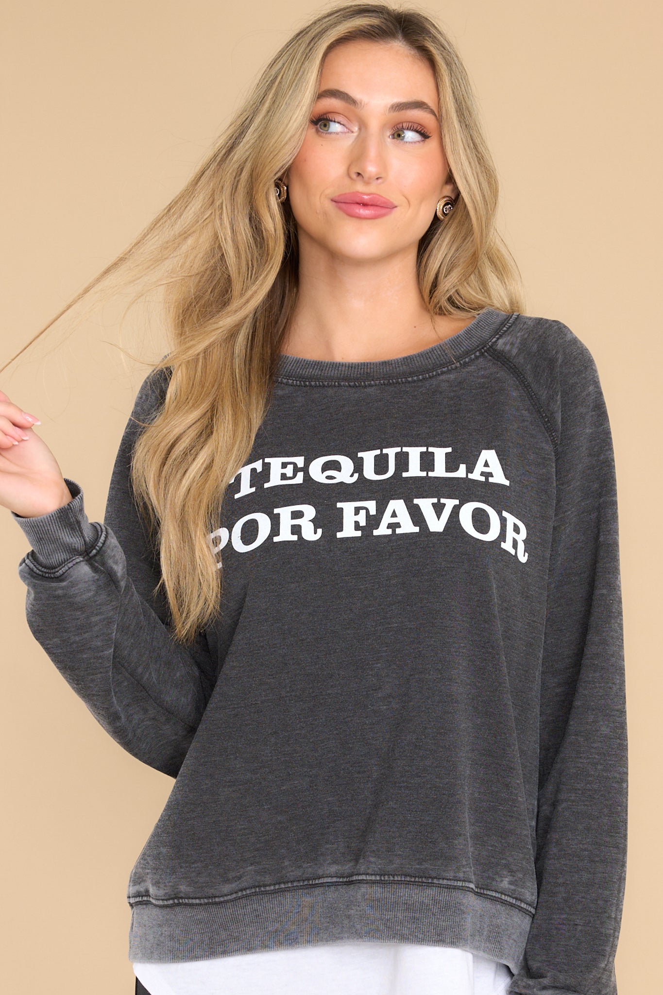 Front view of this sweatshirt that features text across the bust that says "TEQUILA POR FAVOR."