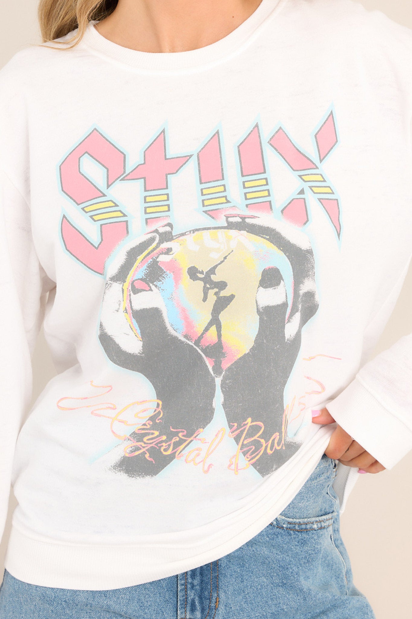 Close up view of this sweatshirt that features a crew neckline, the Styx's sixth studio album graphic, ribbed cuffed sleeves, and a ribbed hemline.