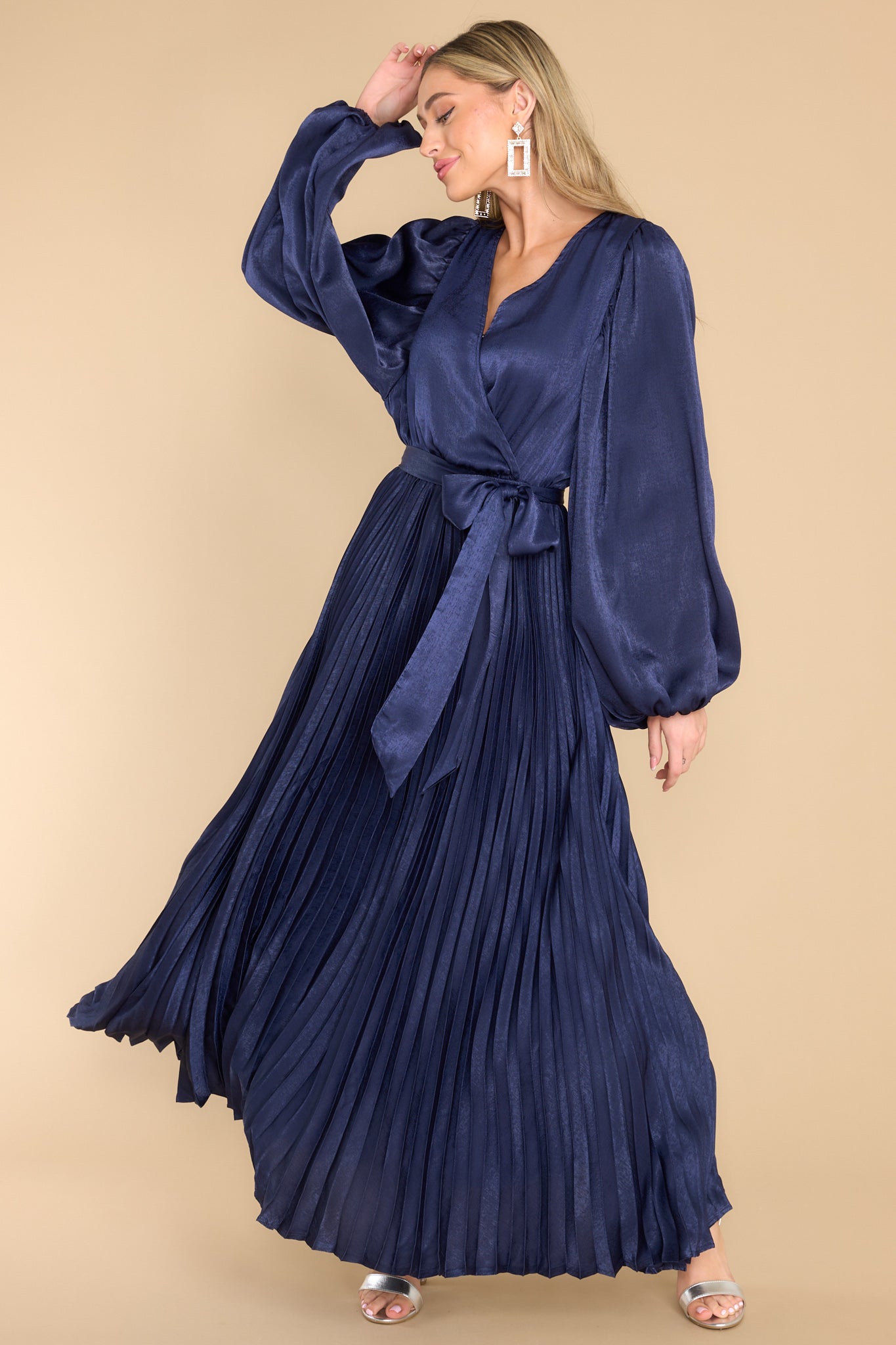 Full body view of this dress that showcases the movement of the fabric in a swaying motion.