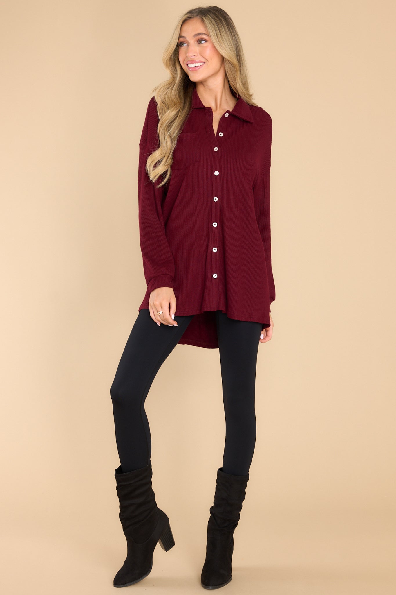 Full body view of this top that features button-down closures on the front, a collared neckline, cuffed sleeves, and a chest pocket. 