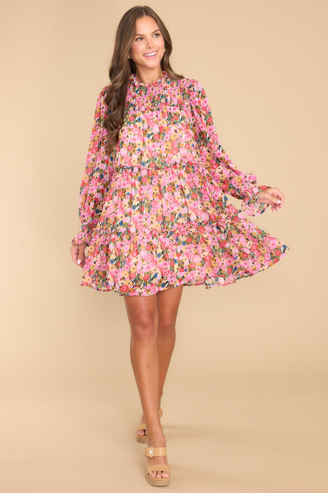 Full body view of this dress that features a flowy skirt.