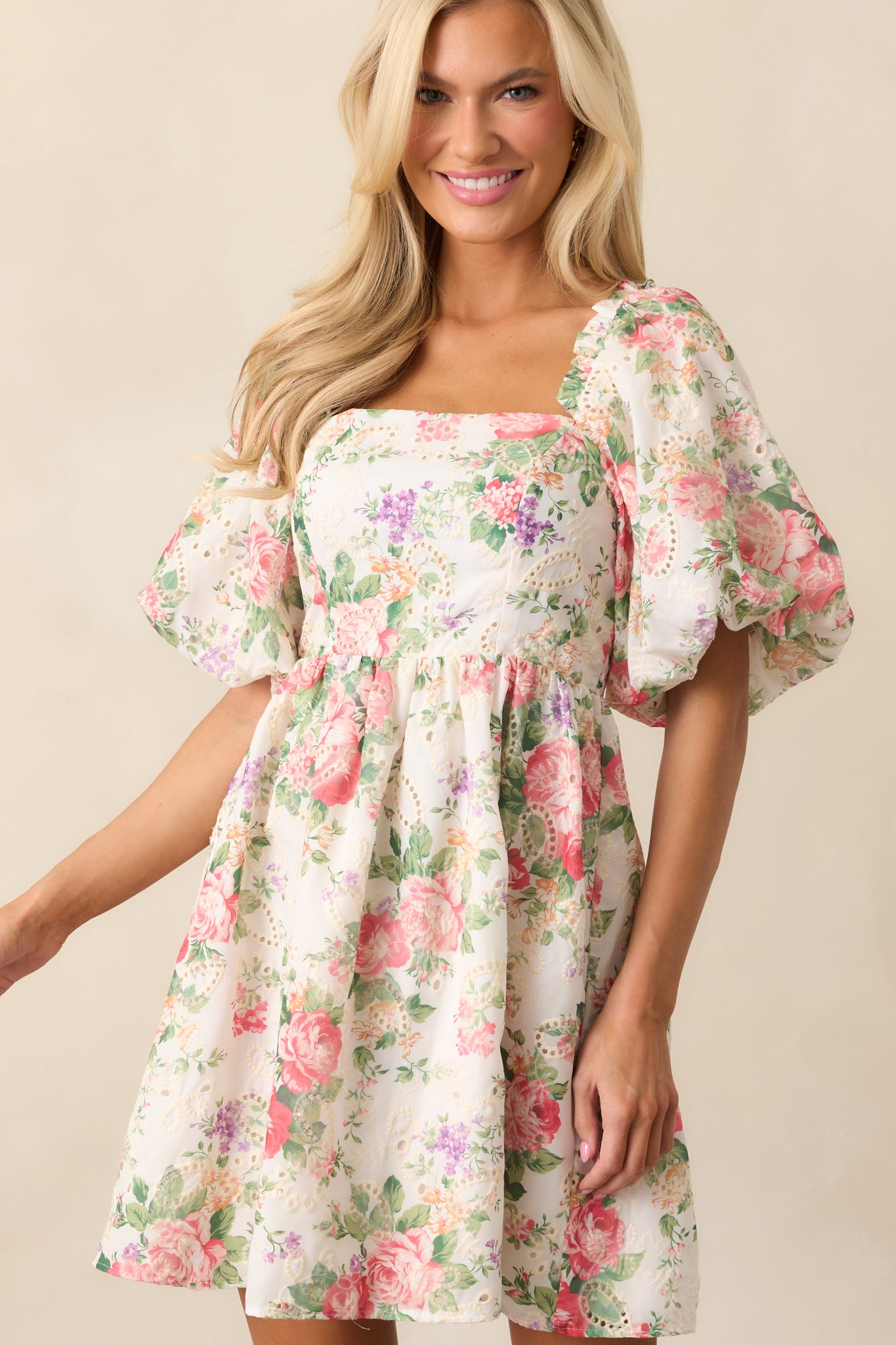 The fitted bodice and smocked back add both comfort and shape to this floral mini dress.