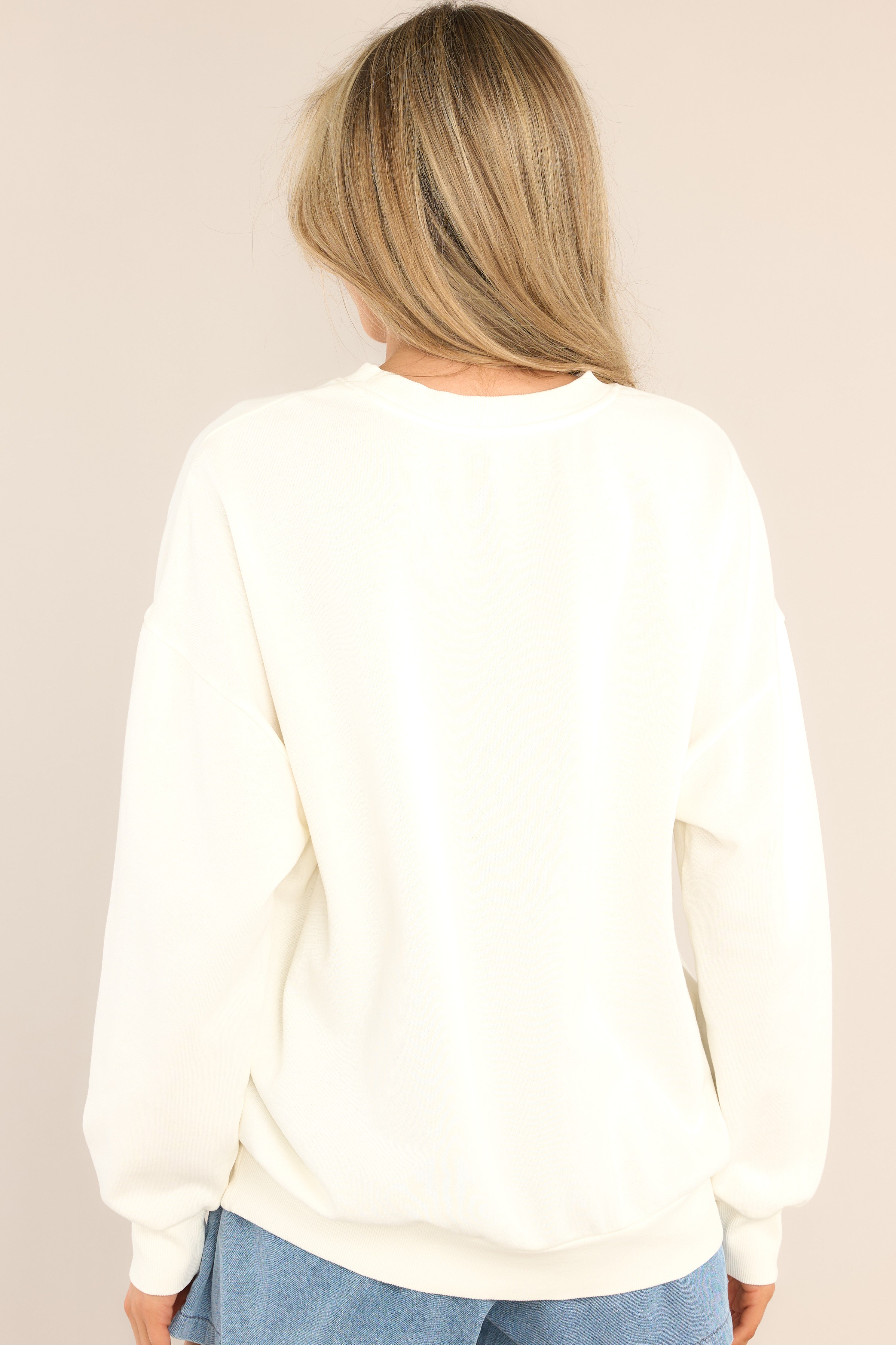 Back view of this sweatshirt that features a crew neckline, dropped shoulders, ribbed cuffed sleeves, and a ribbed hemline.