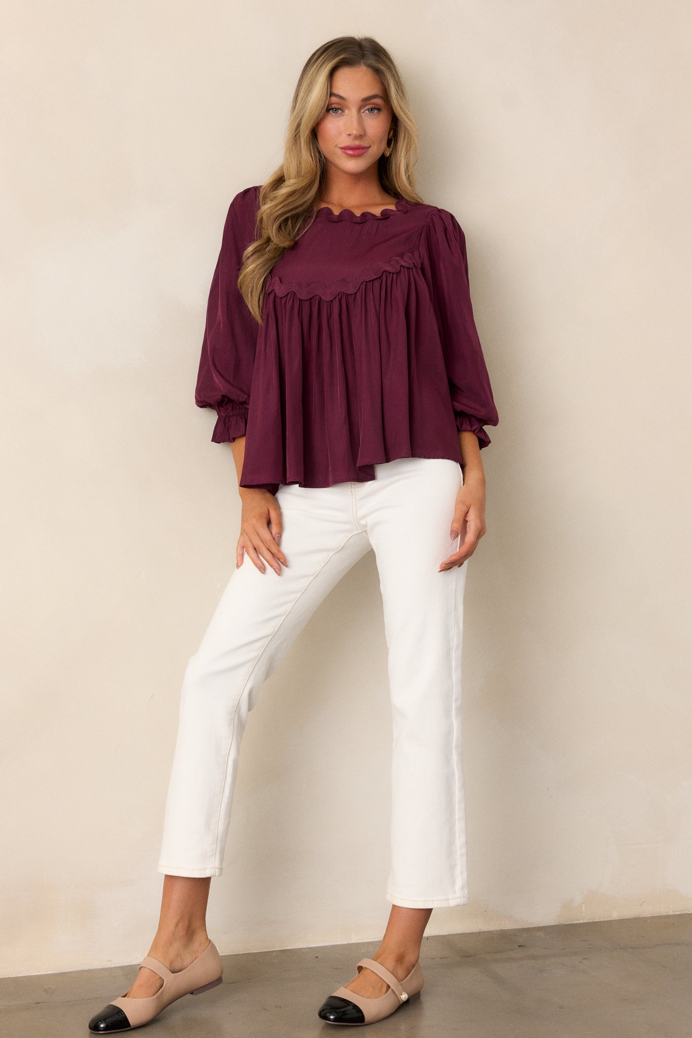 Elegant dark sangria top showcasing scalloped yoke detailing, a scalloped neckline, and flowy design with 3/4 poet sleeves.