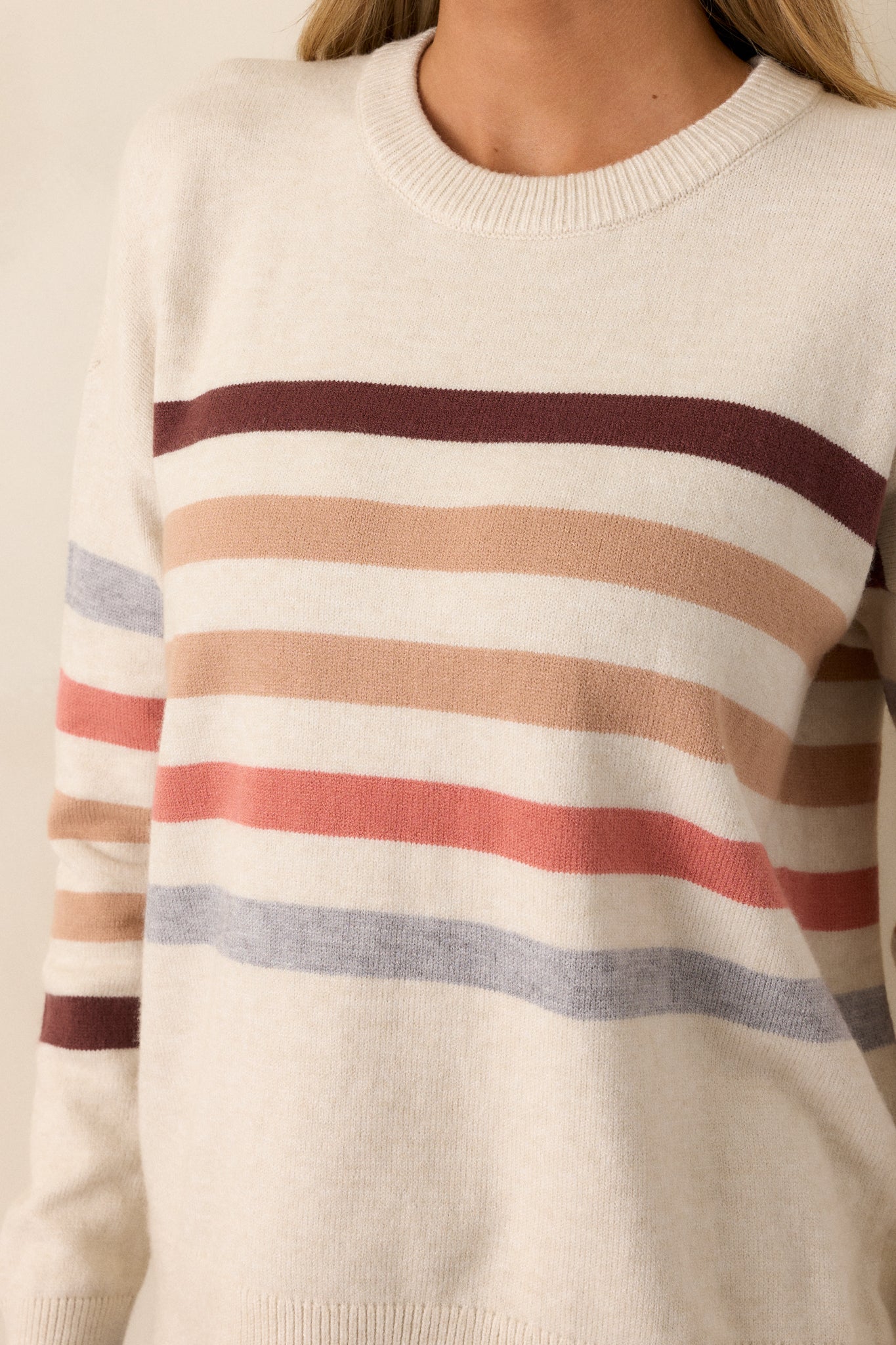 Extreme close-up of the ribbed hem and horizontal stripe design, showing the texture and stitching detail.