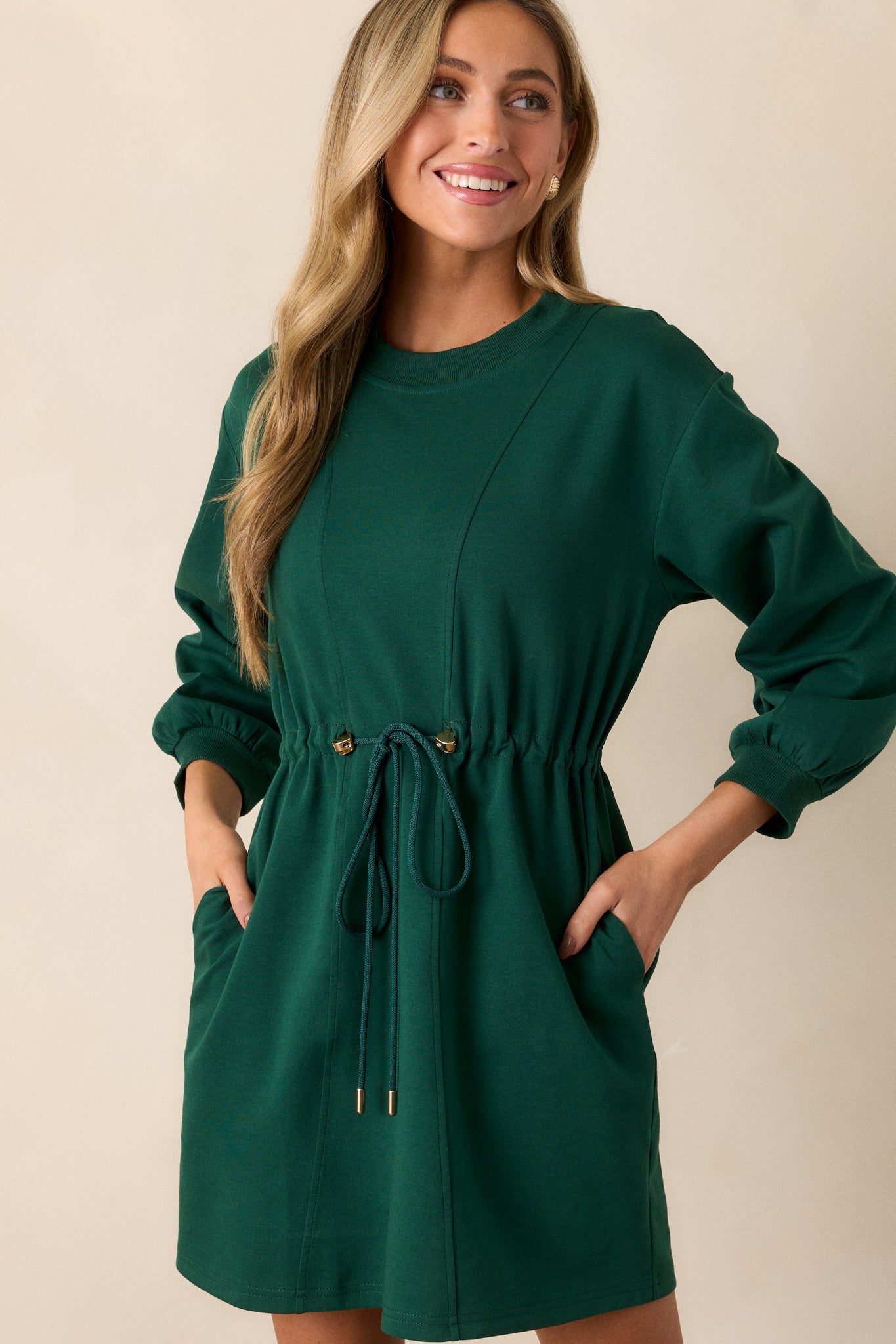 A cropped view of the upper portion of the dress, emphasizing the ribbed crew neckline and the texture of the fabric.