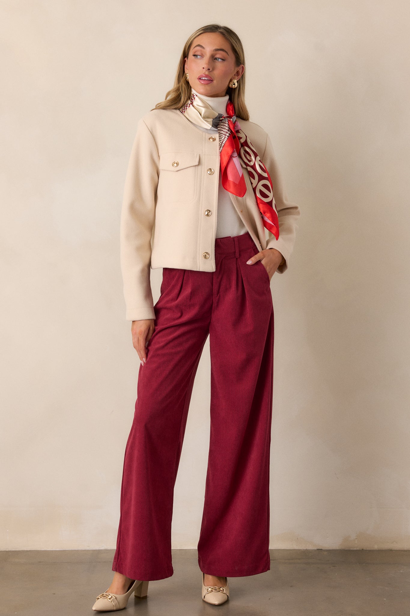 Cranberry pants shown in full length, emphasizing the rich color, corduroy-like material, and relaxed fit.