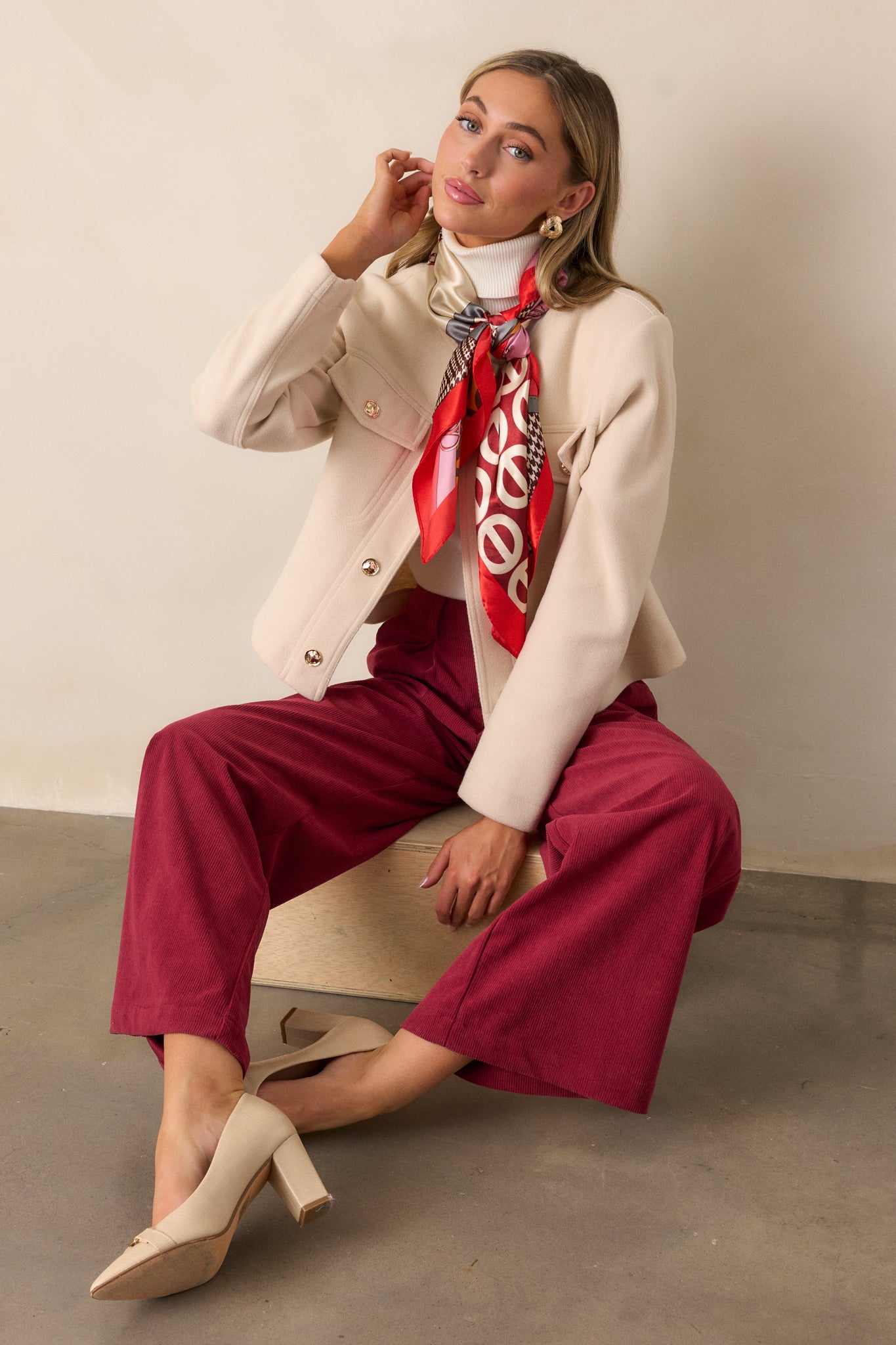 Full-length view of cranberry pants with a straight-leg cut, highlighting the corduroy-like texture and zipper hook and eye closure.