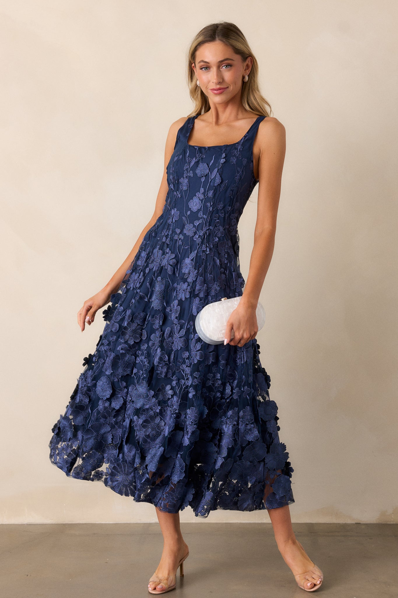 Side angle of the dress, emphasizing the flow and shape of the flare design at the skirt.