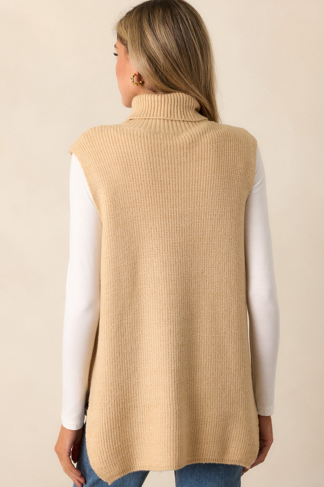 Rear view of the taupe sweater vest, focusing on the smooth, uninterrupted back panel and sleeveless cut.