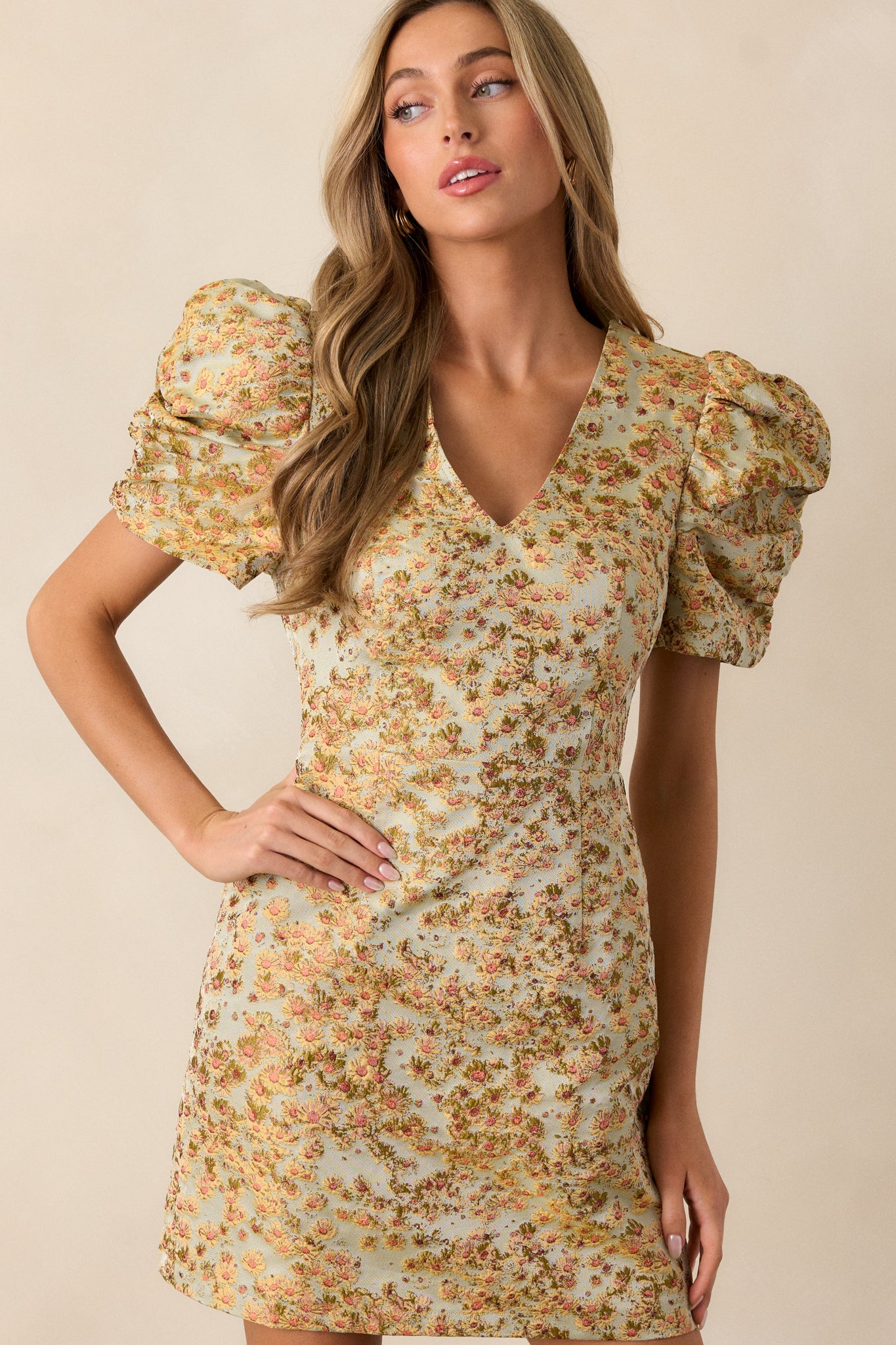 Close-up of the waist area of the honey dress, showing the fitted design and subtle floral pattern that adds texture to the dress.