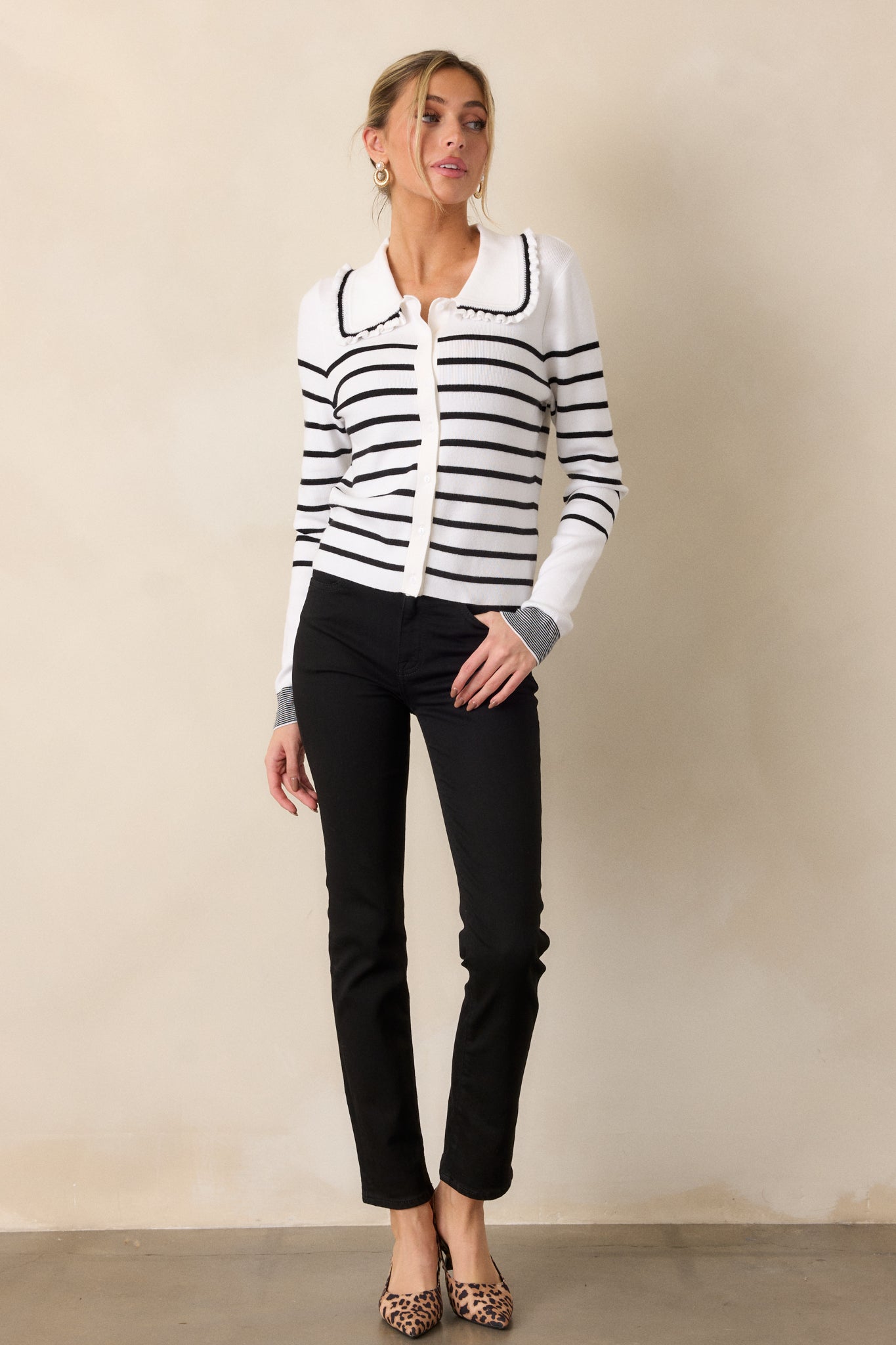 Front view of the black jeans showcasing the high waist and straight leg cut, highlighting the classic silhouette.