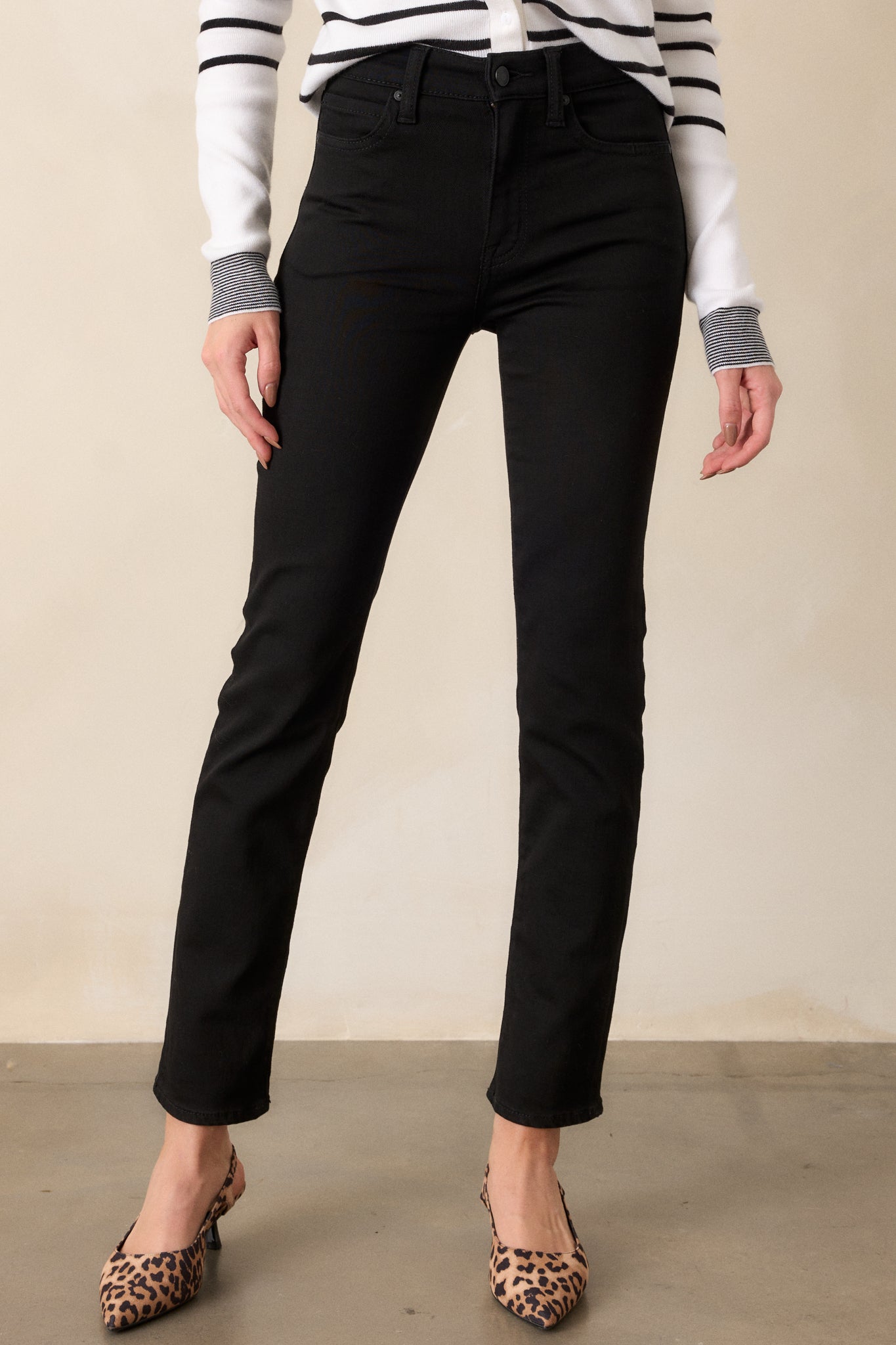 Front angle of the jeans, emphasizing the straight leg fit and the functional belt loops that add versatility.