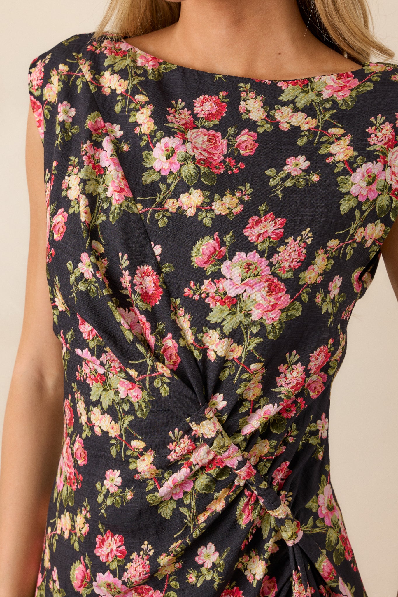 Close-up of the floral fabric and stitching, showing texture and color detail on the side twist.