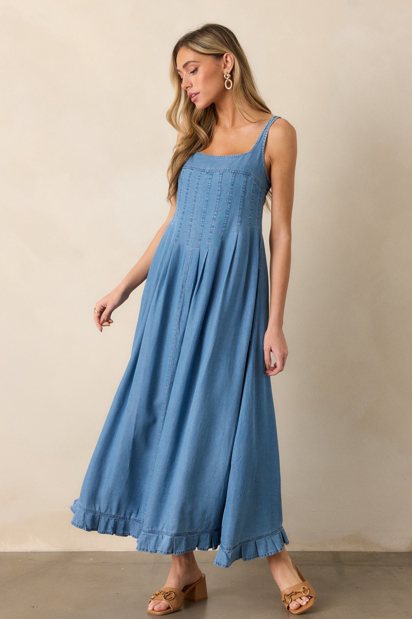 Focus on the silhouette of the dress, showcasing the fitted top with smocked back and the flared A-line skirt.