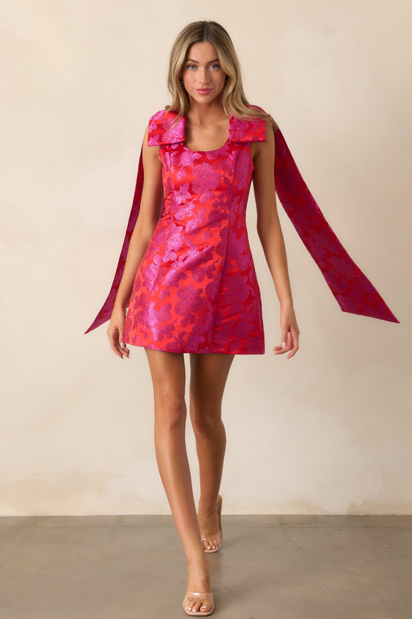 Front view of the red mini dress, showcasing the scoop neckline, fit-and-flare design, and jacquard fabric.