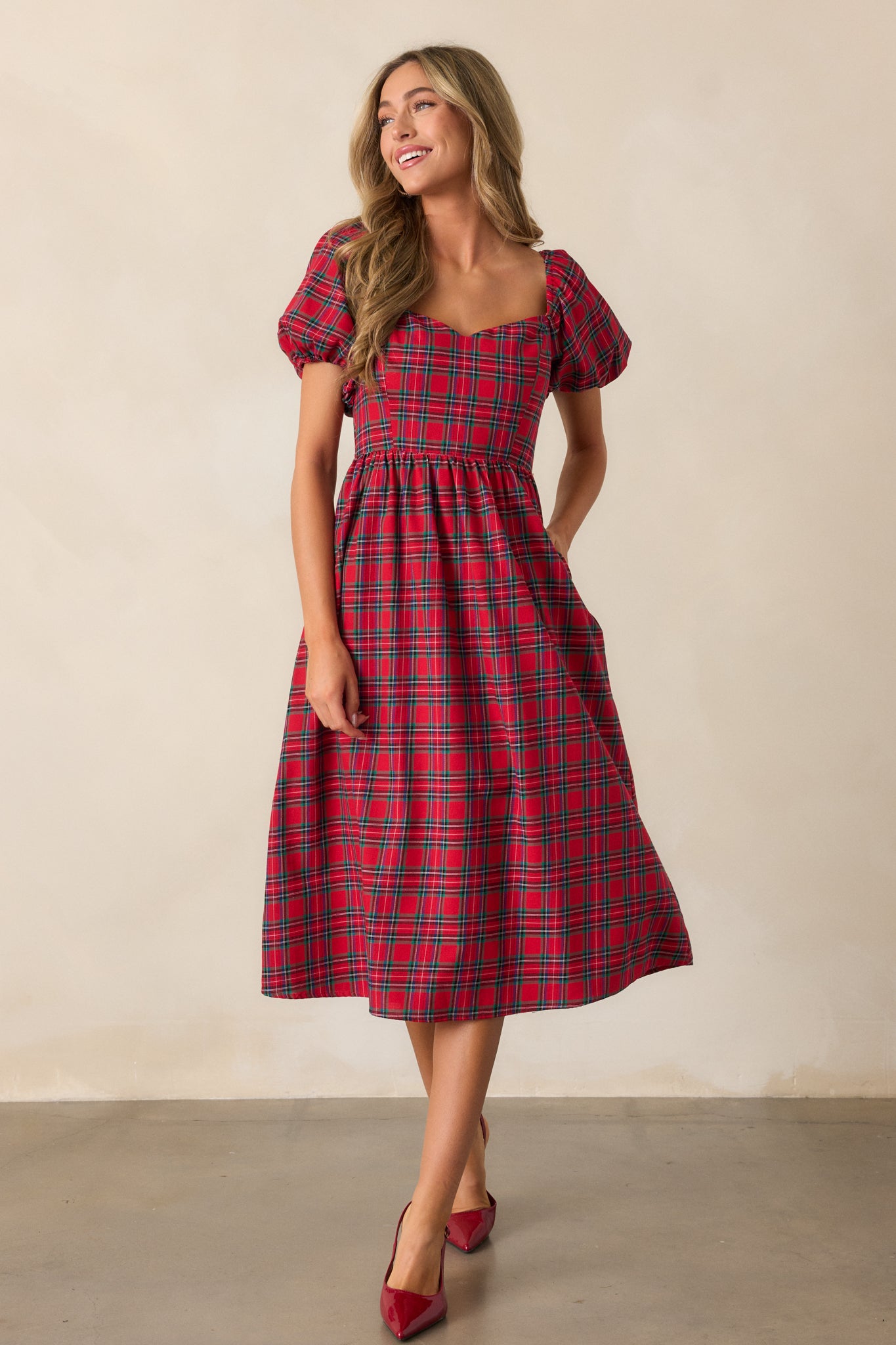 Front-facing view of the red dress showing the full-length fit and the detailed plaid pattern.