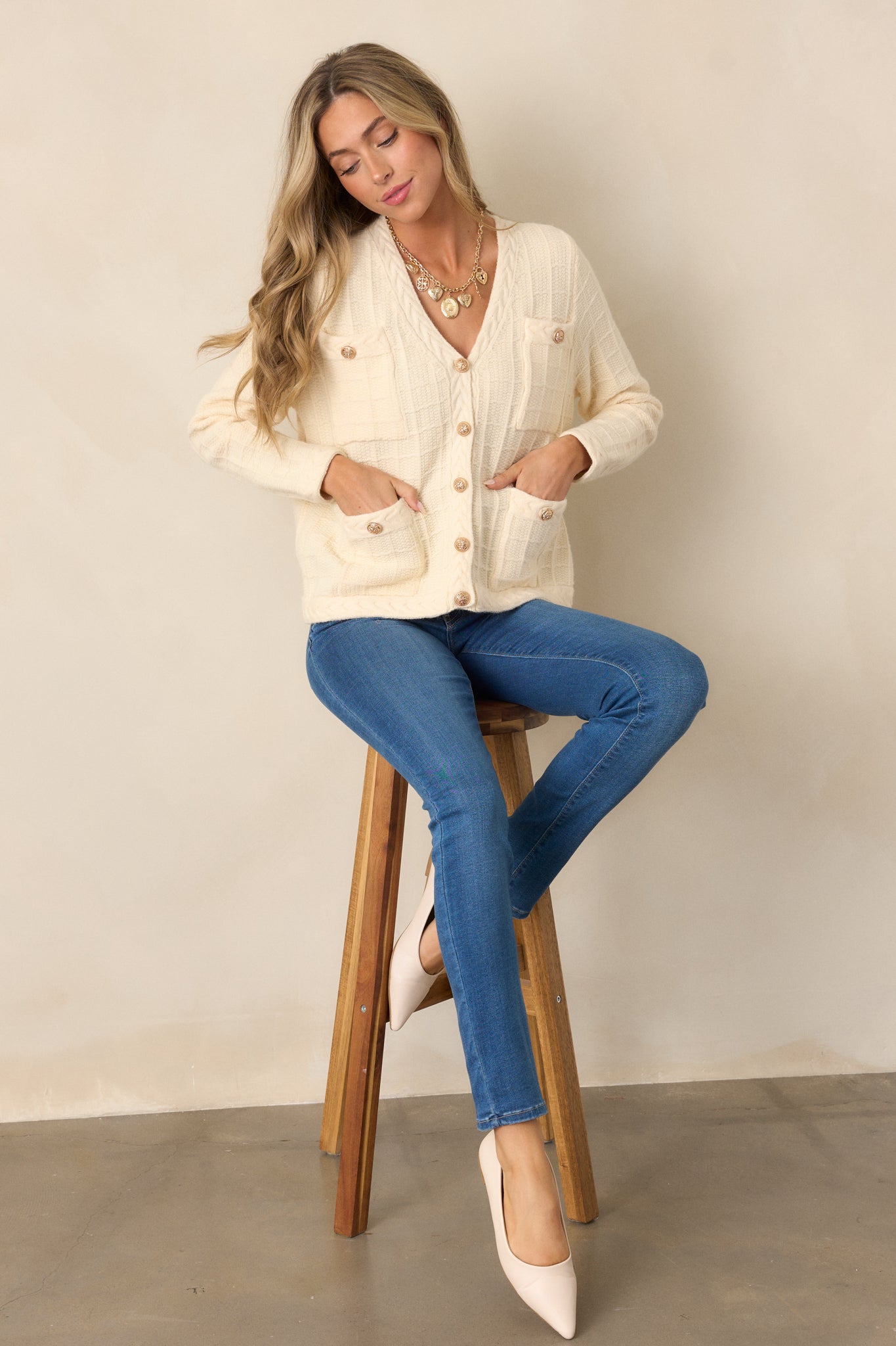 Another full-body shot of the medium wash jeans, emphasizing their skinny fit and high waist. The functional belt loops and pockets are clearly visible, showcasing the clean design.