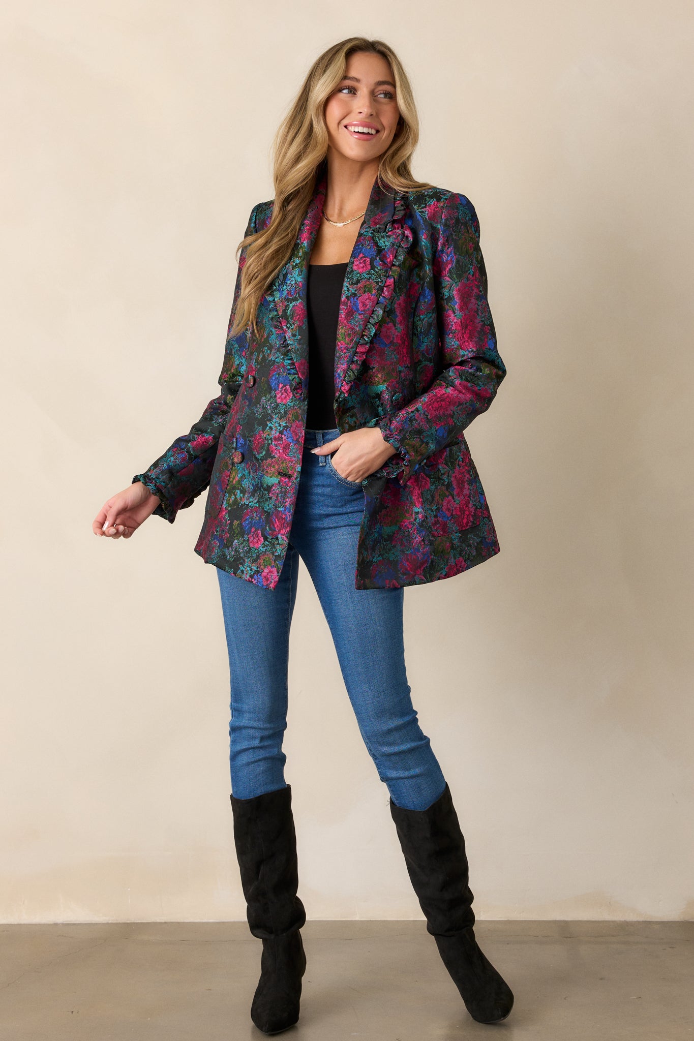 Another full-length angle displaying the blazer’s hip-length cut, long sleeves, and functional hip pockets integrated within the floral design.