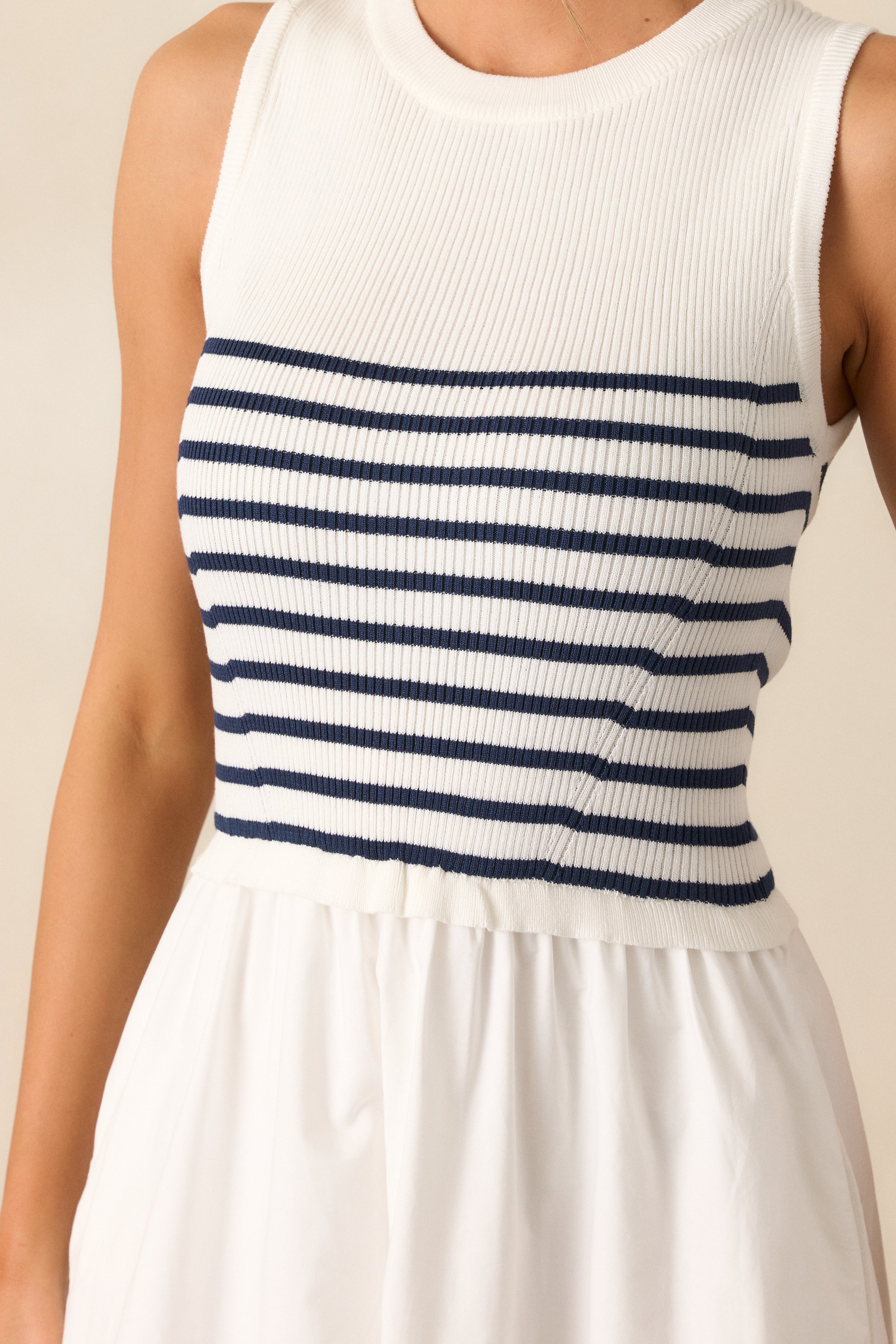 Close-up of the white stripe pattern on the dress, showcasing the smooth fabric and clean lines of the fitted bodice.