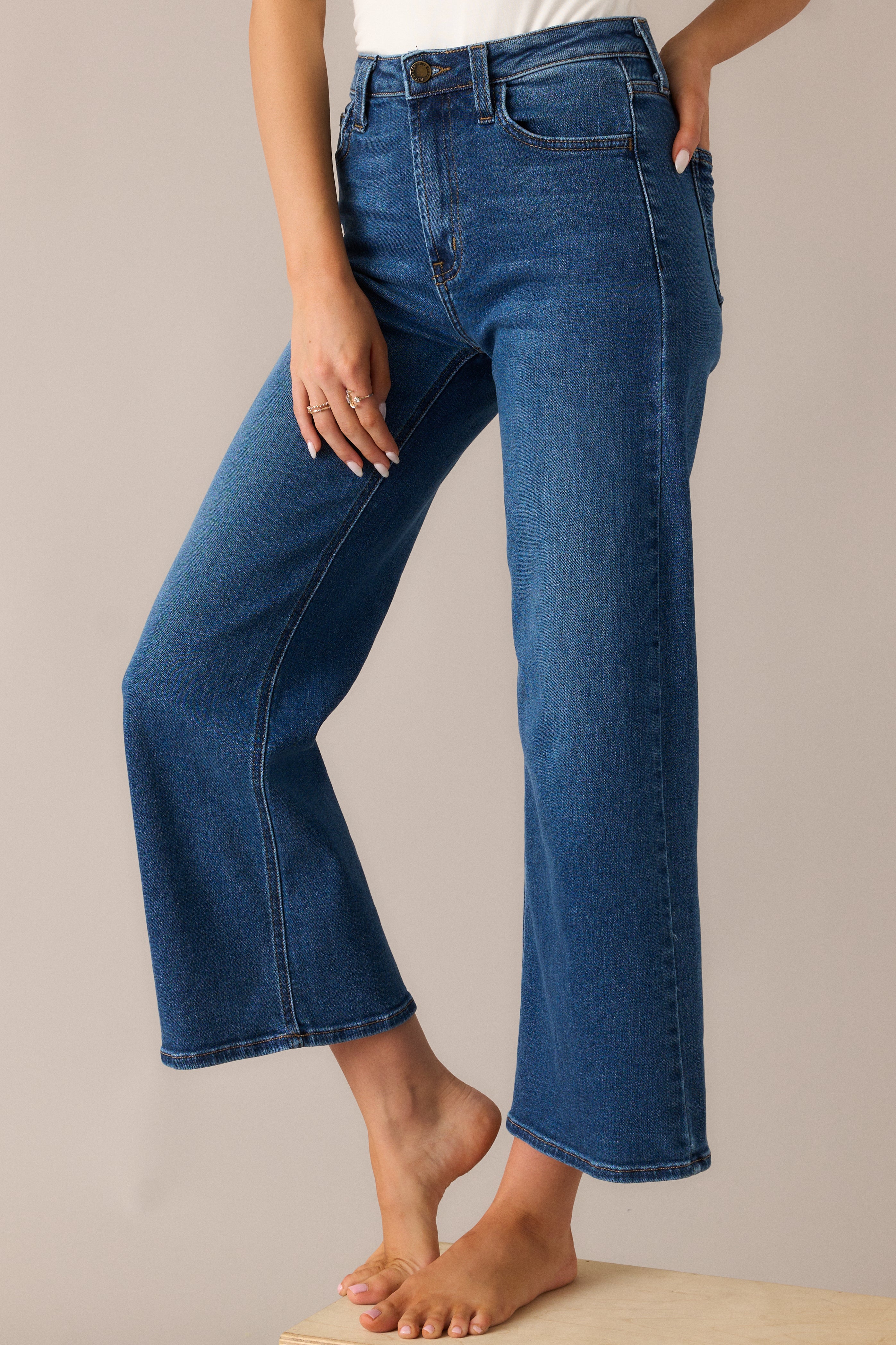 Close-up of the high waist and wide-leg design, showcasing the relaxed fit and slightly cropped length, with functional belt loops and pockets for added style.