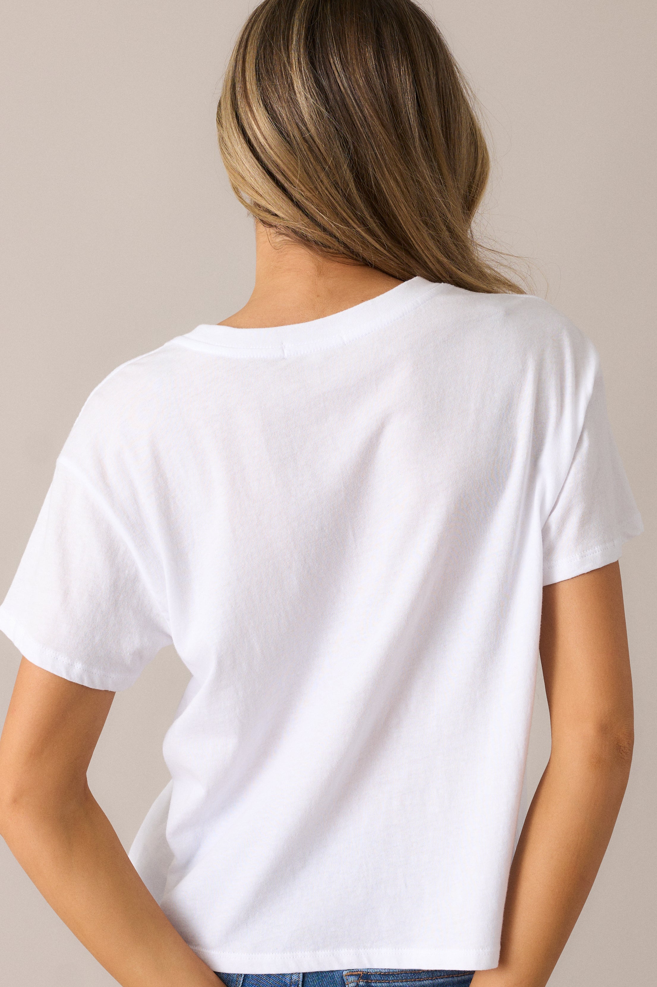 The tee from behind, highlighting the smooth, relaxed fit and the simplicity of the ribbed neckline and short sleeves for an effortless look.