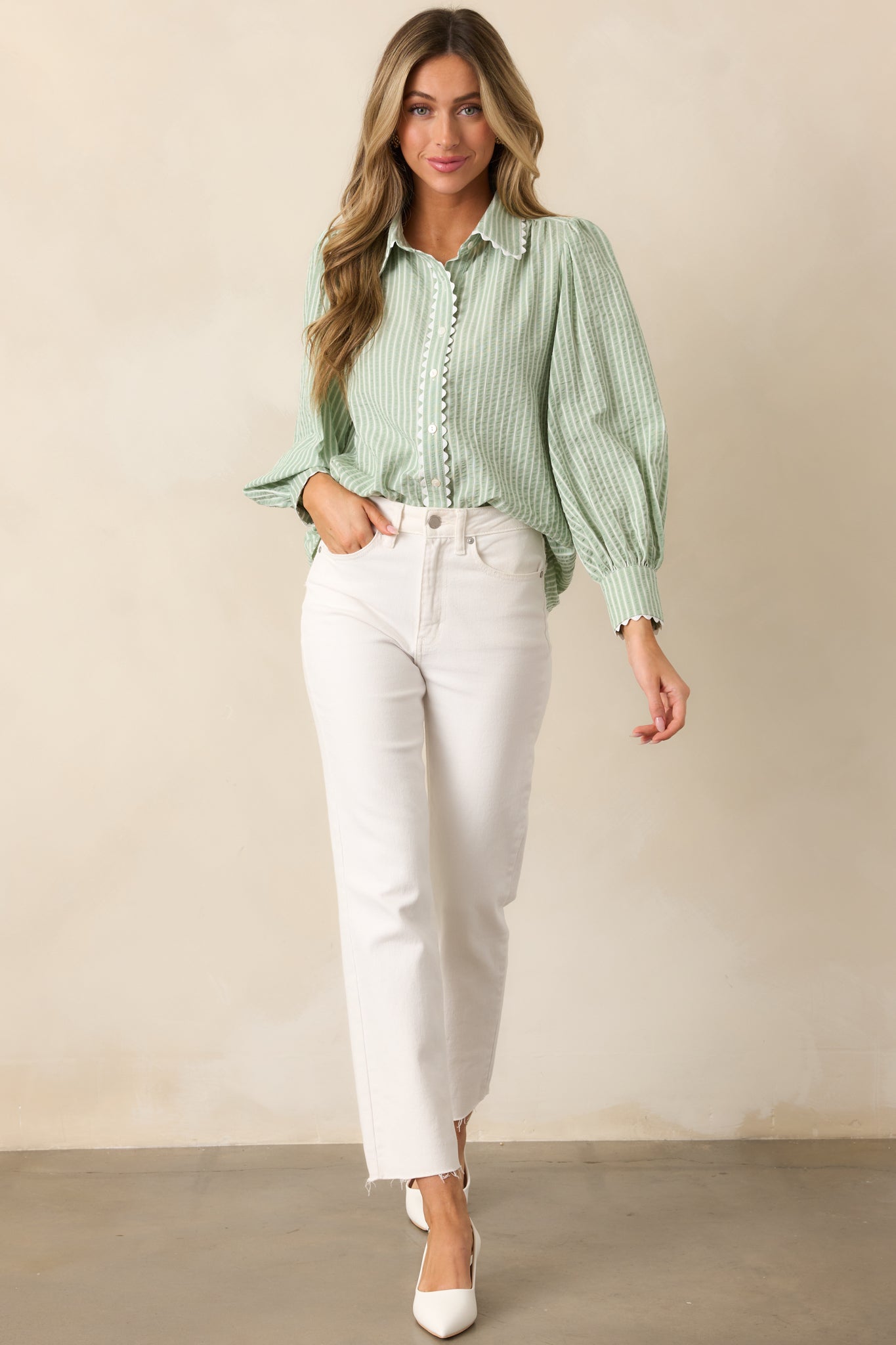 A stylish sage blouse with a collared neckline, button front design, and a subtle striped print for a polished look.